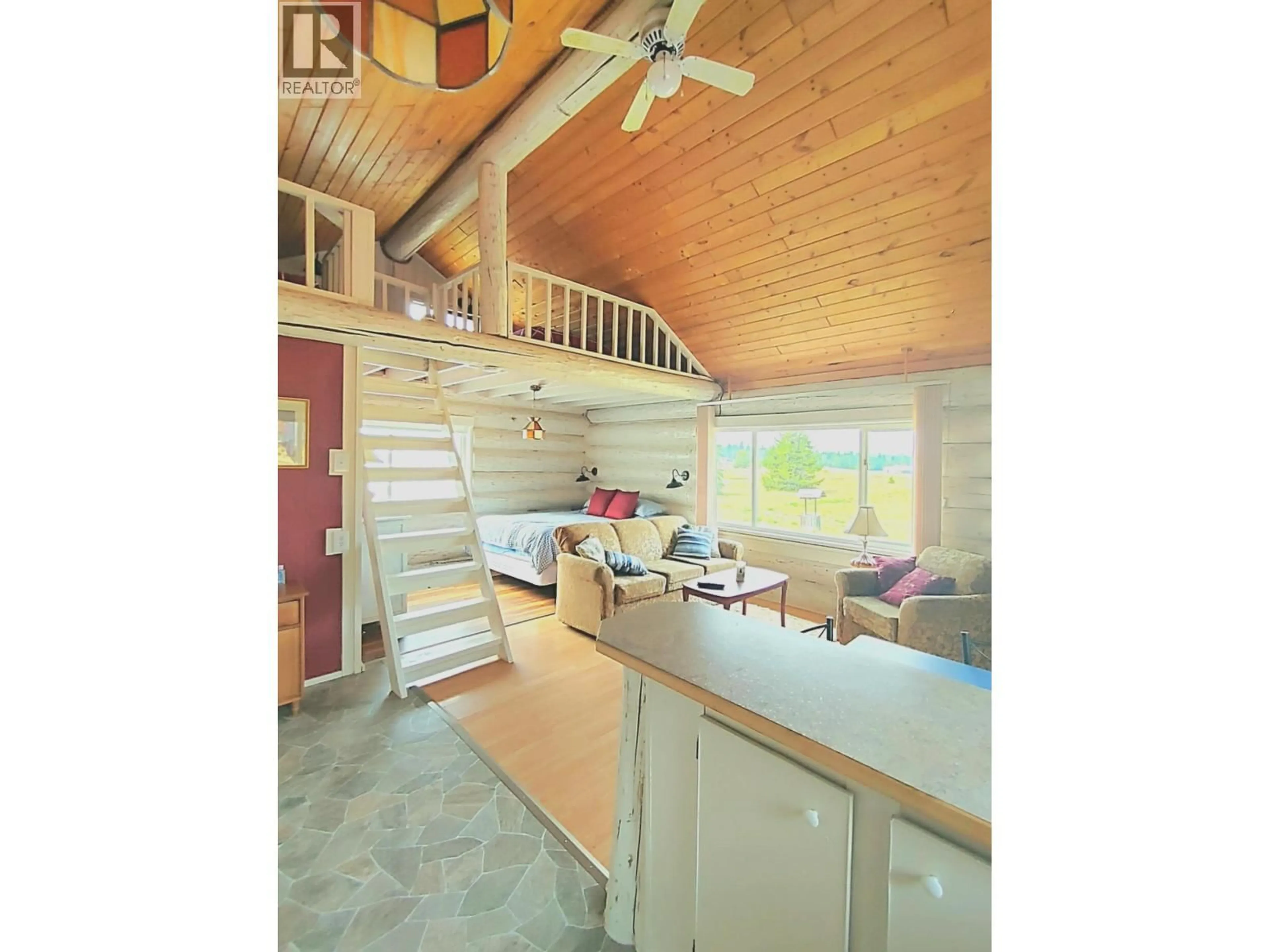 Open concept kitchen, wood/laminate floor for 6210 ROBIN ROAD, Horse Lake British Columbia V0K2E3