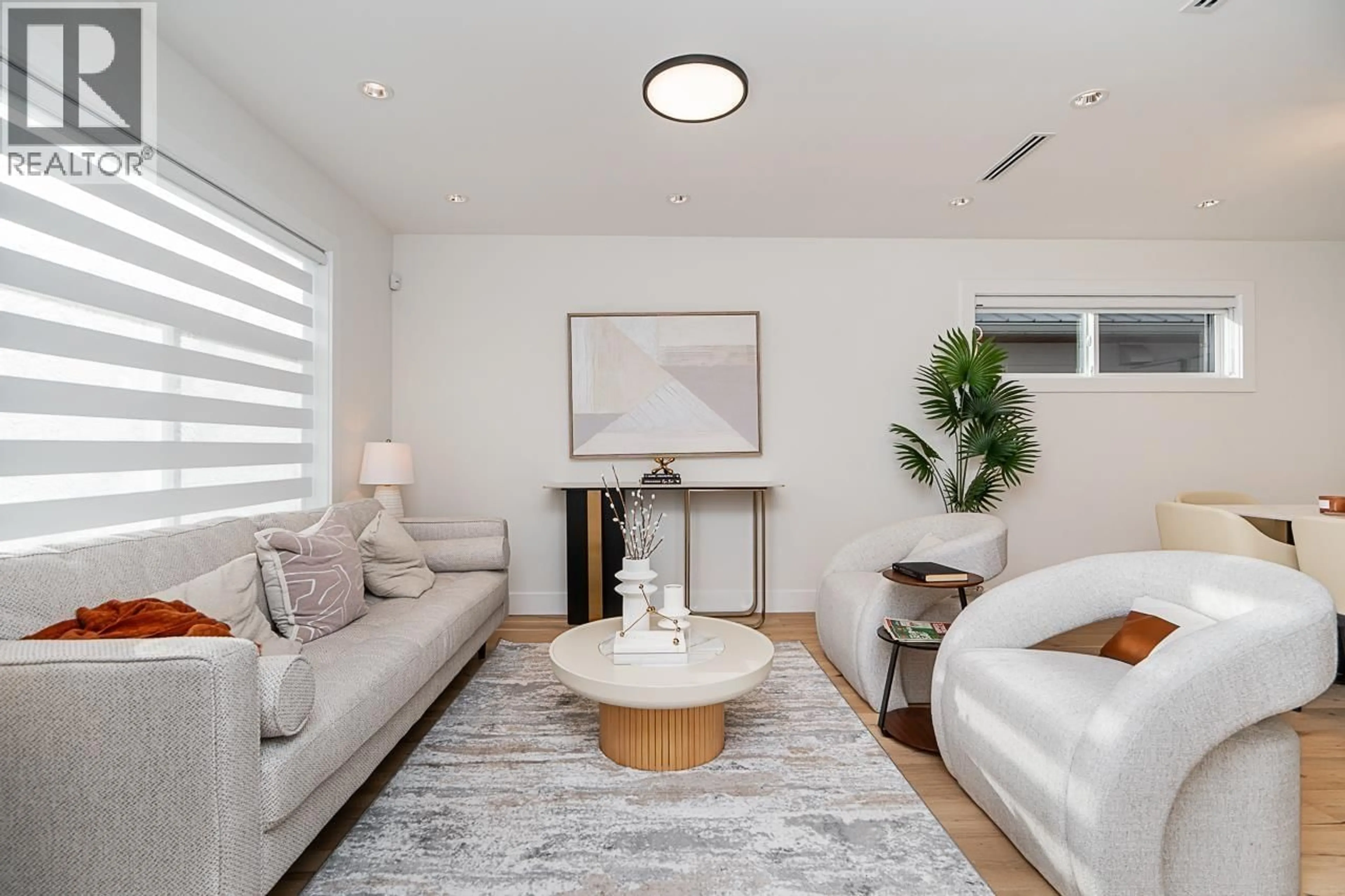 Living room with furniture, unknown for 4917 VENABLES STREET, Burnaby British Columbia V5B1X8