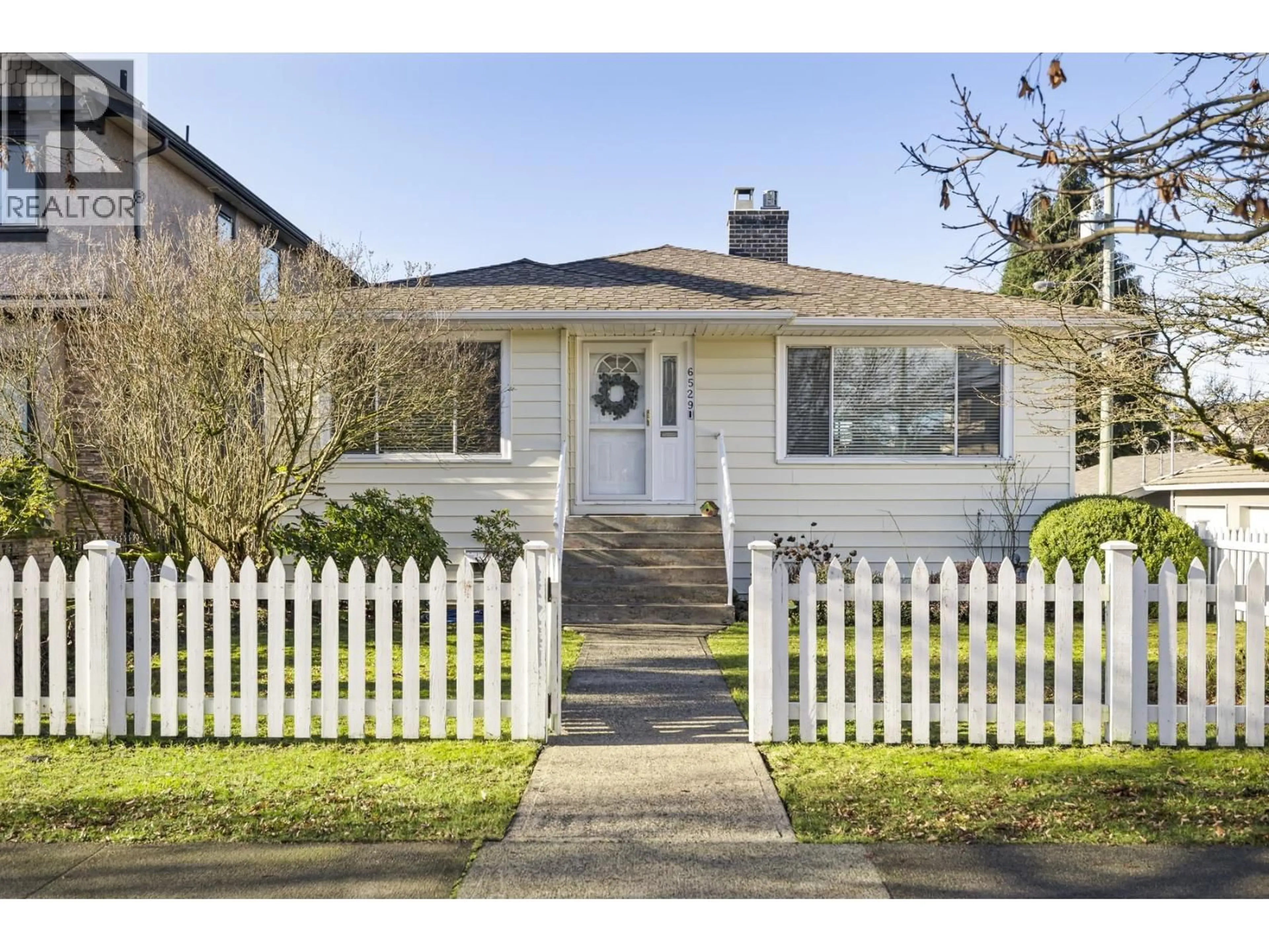 Home with vinyl exterior material, street for 6529 DAWSON STREET, Vancouver British Columbia V5S2W2