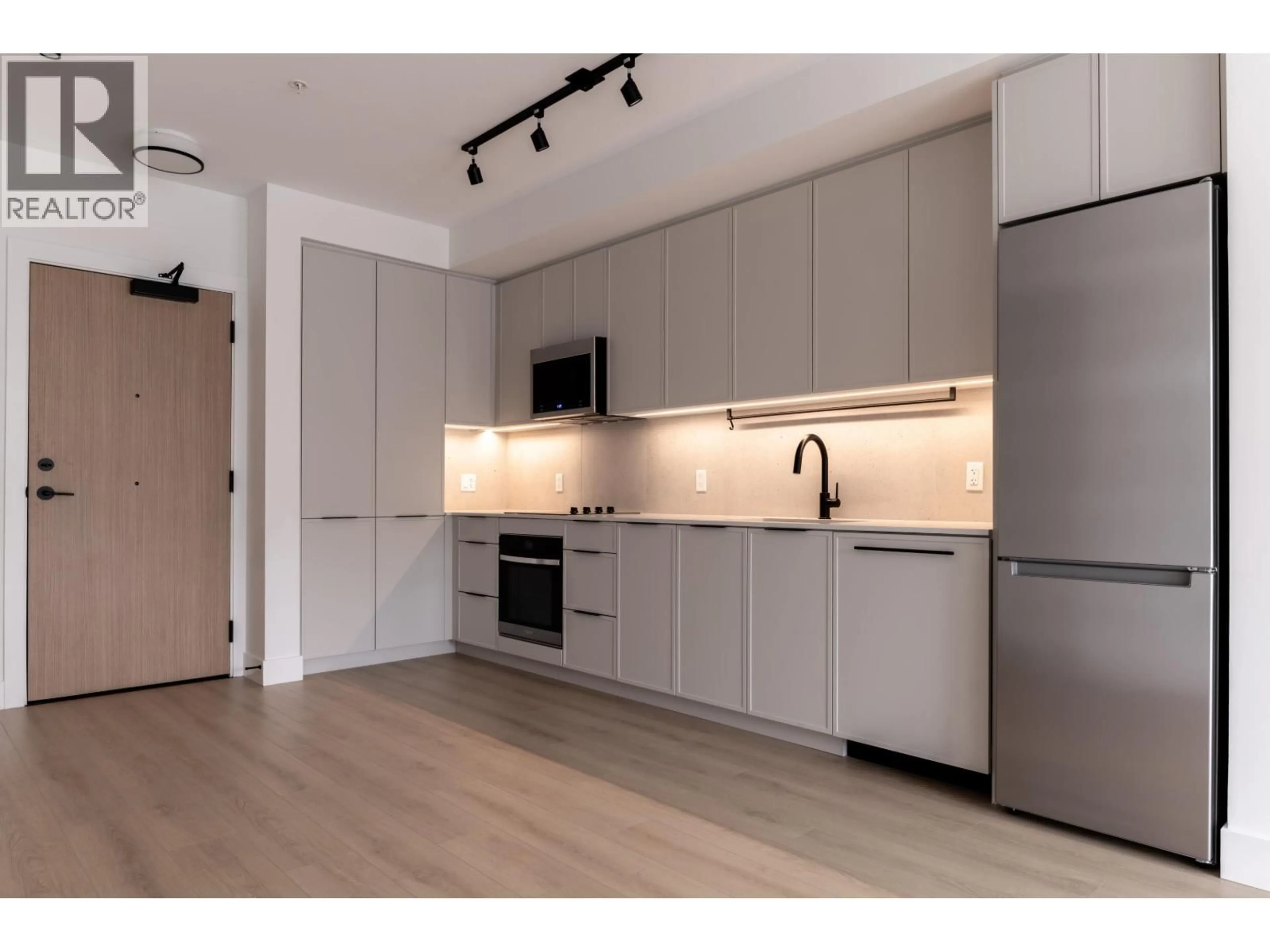 Open concept kitchen, wood/laminate floor for 308 - 3075 MURRAY STREET, Coquitlam British Columbia V3H1X3