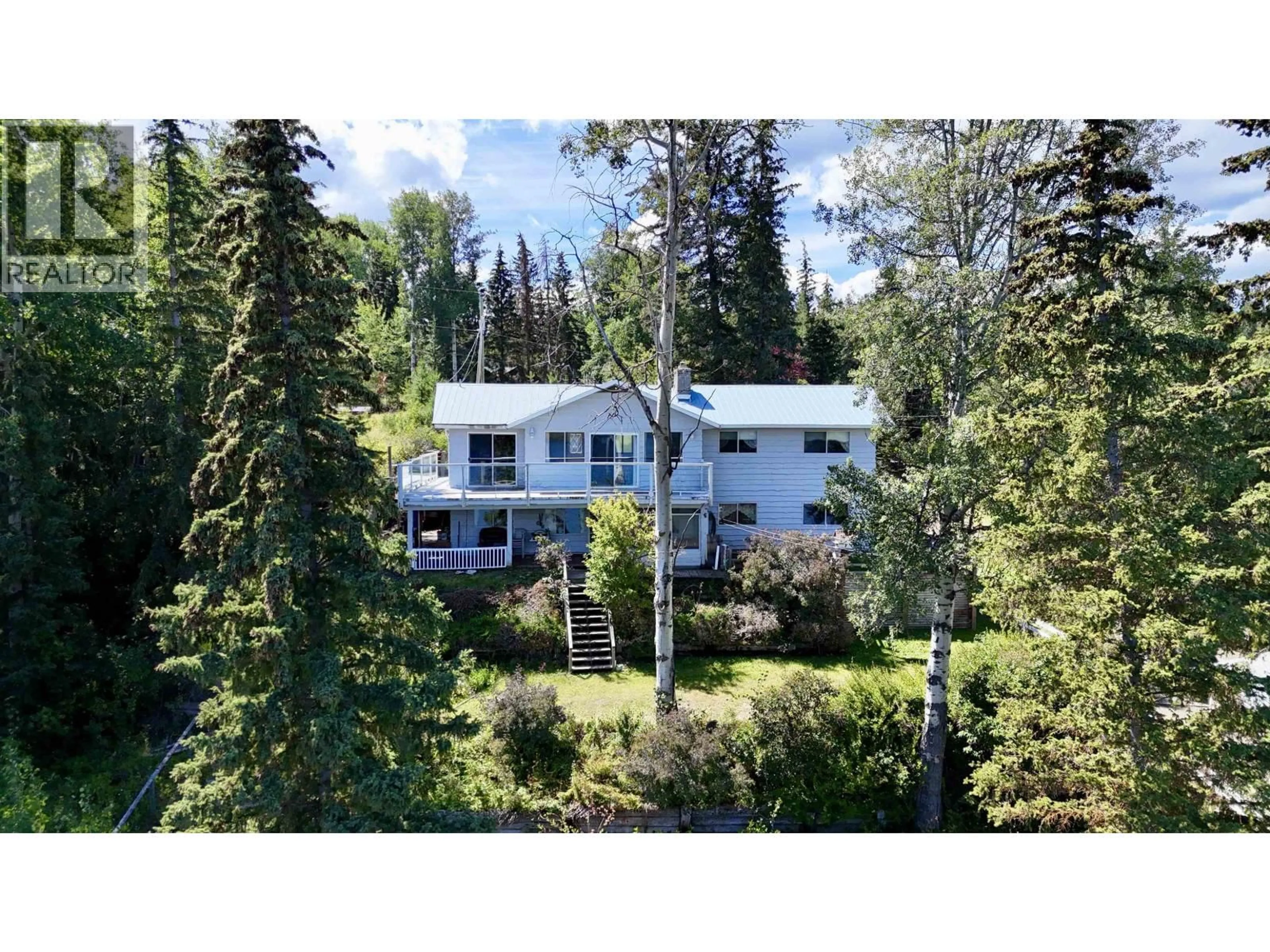 A pic from outside/outdoor area/front of a property/back of a property/a pic from drone, forest/trees view for 6367 MULLIGAN DRIVE, Horse Lake British Columbia V0K2E3