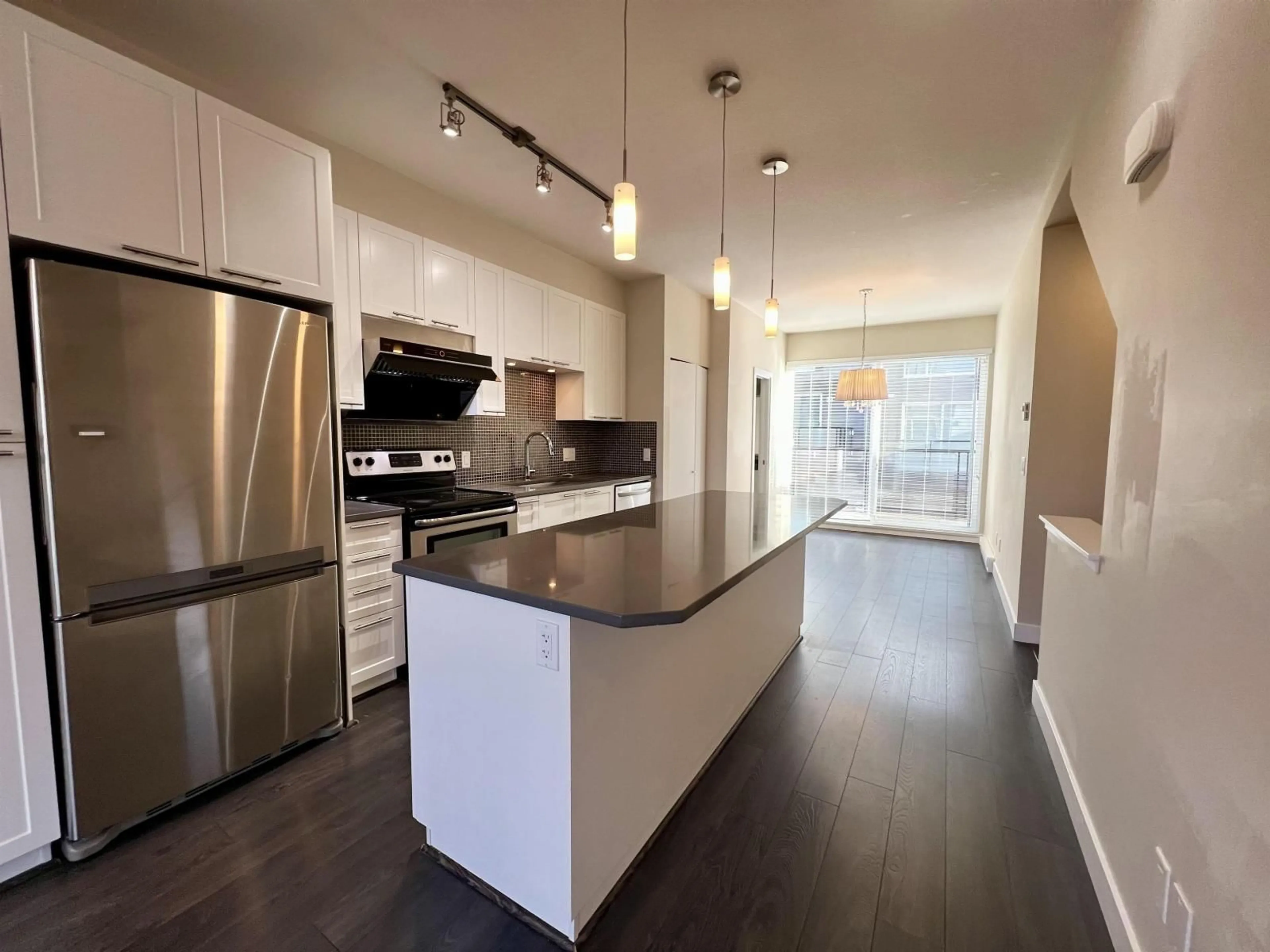 Open concept kitchen, wood/laminate floor for 113 - 2228 162 STREET, Surrey British Columbia V3Z6P4