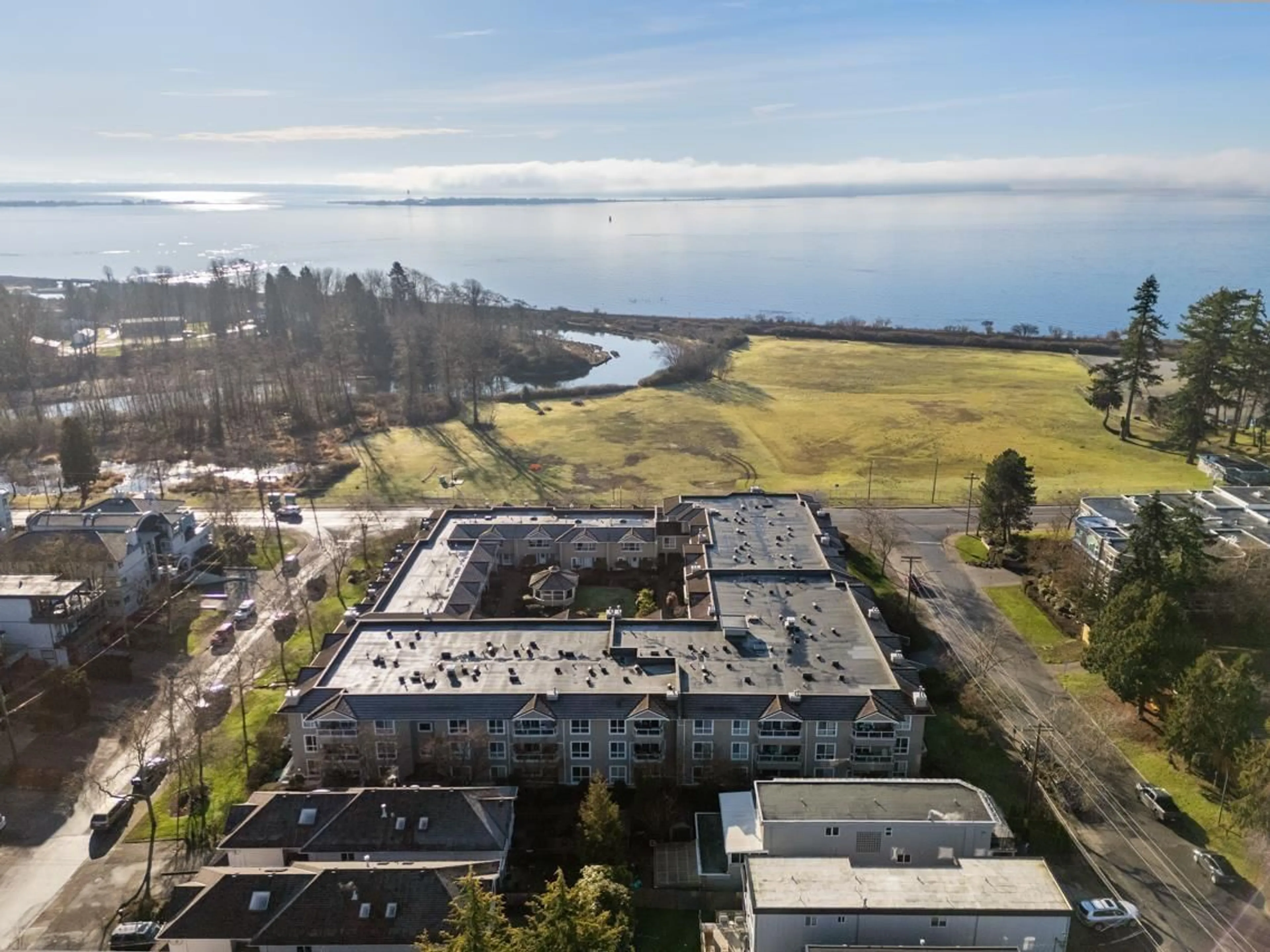 A pic from outside/outdoor area/front of a property/back of a property/a pic from drone, water/lake/river/ocean view for 312 - 15875 MARINE DRIVE, White Rock British Columbia V4B5J2
