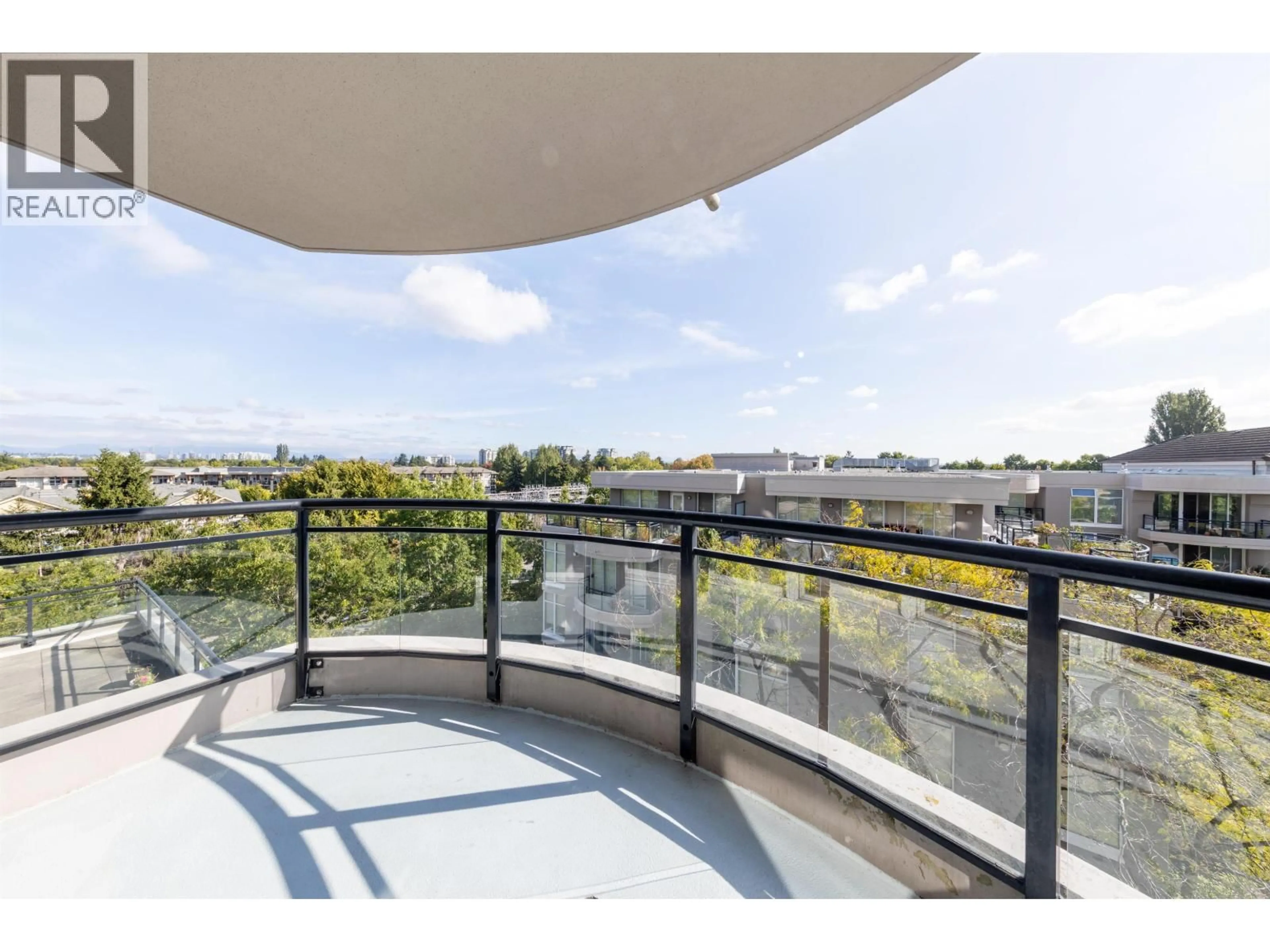 Balcony in the apartment, city buildings view from balcony for 702 - 8460 GRANVILLE AVENUE, Richmond British Columbia V6Y4E7