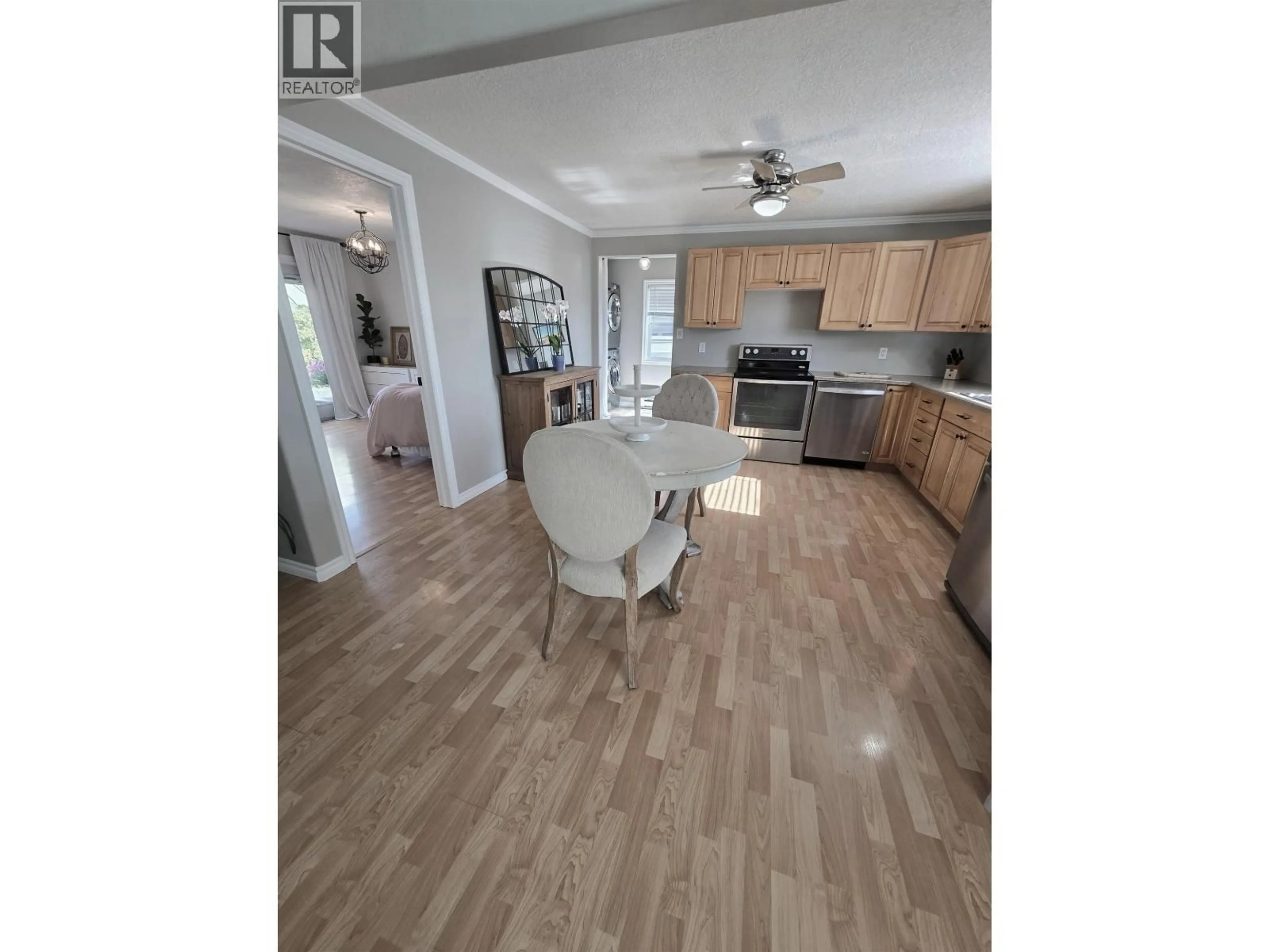 Open concept kitchen, unknown for 8224 99 AVENUE, Fort St. John British Columbia V1J1S7