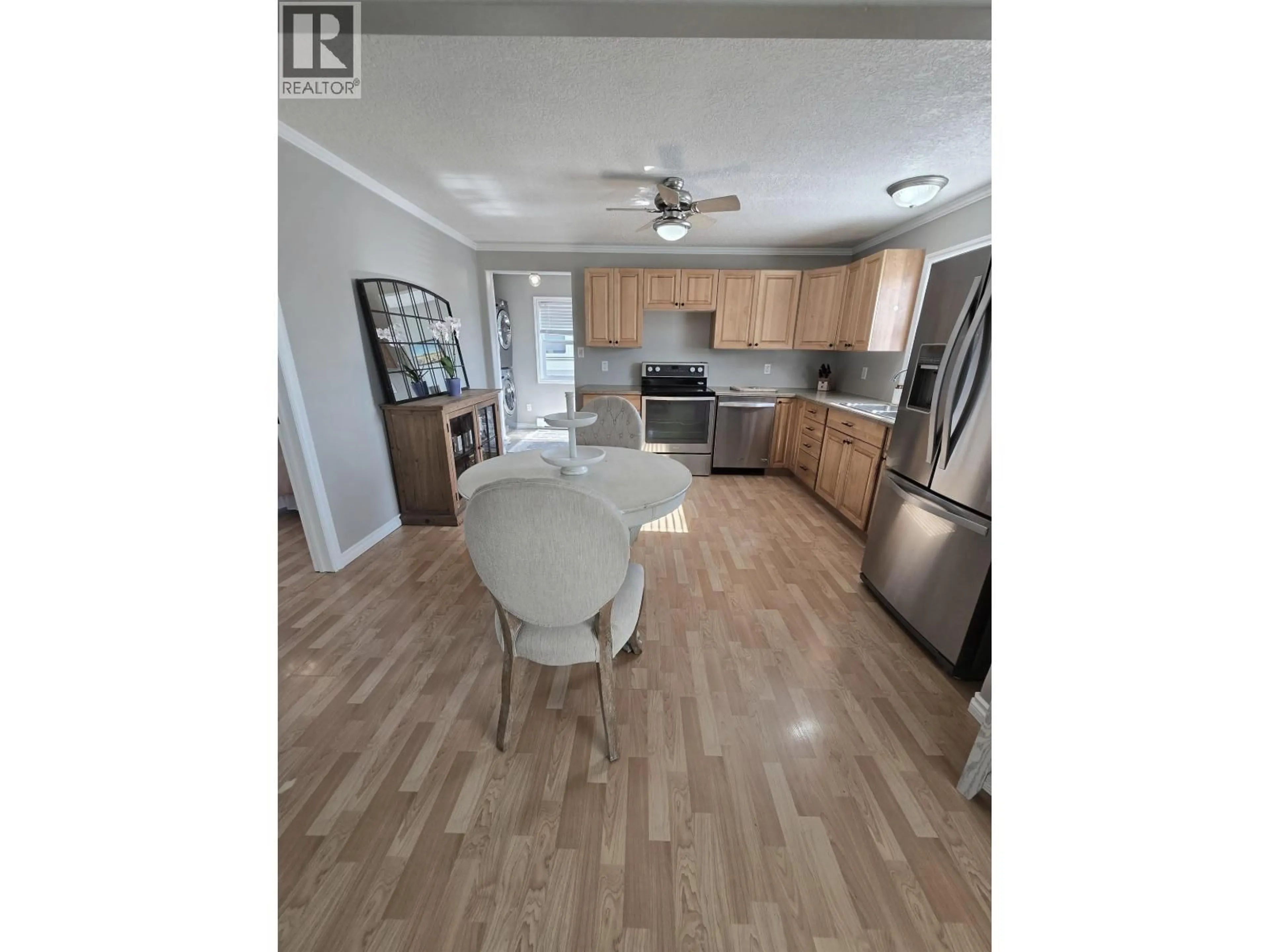 Open concept kitchen, unknown for 8224 99 AVENUE, Fort St. John British Columbia V1J1S7
