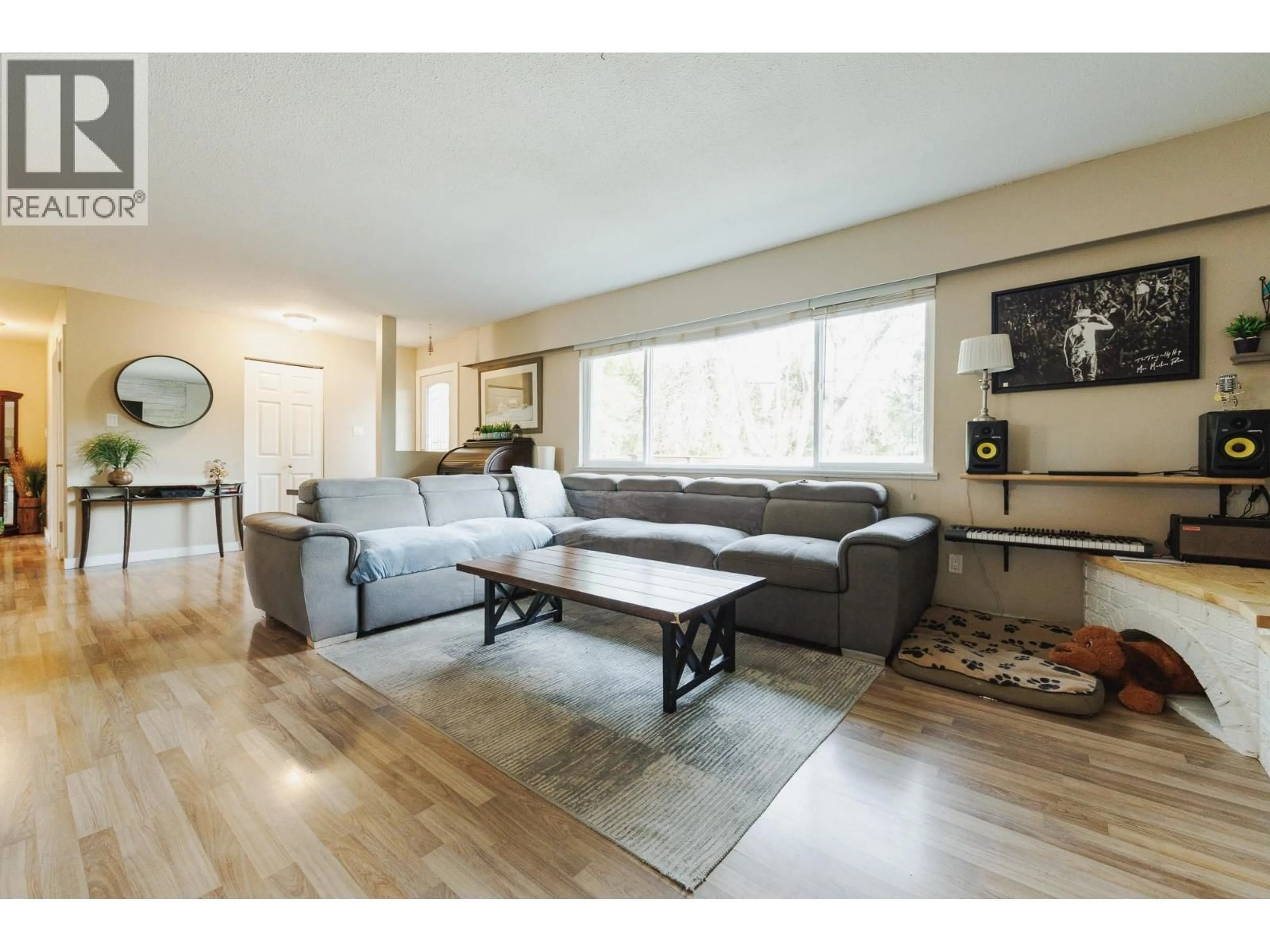 Living room with furniture, wood/laminate floor for 12045 261 STREET, Maple Ridge British Columbia V2W2A5