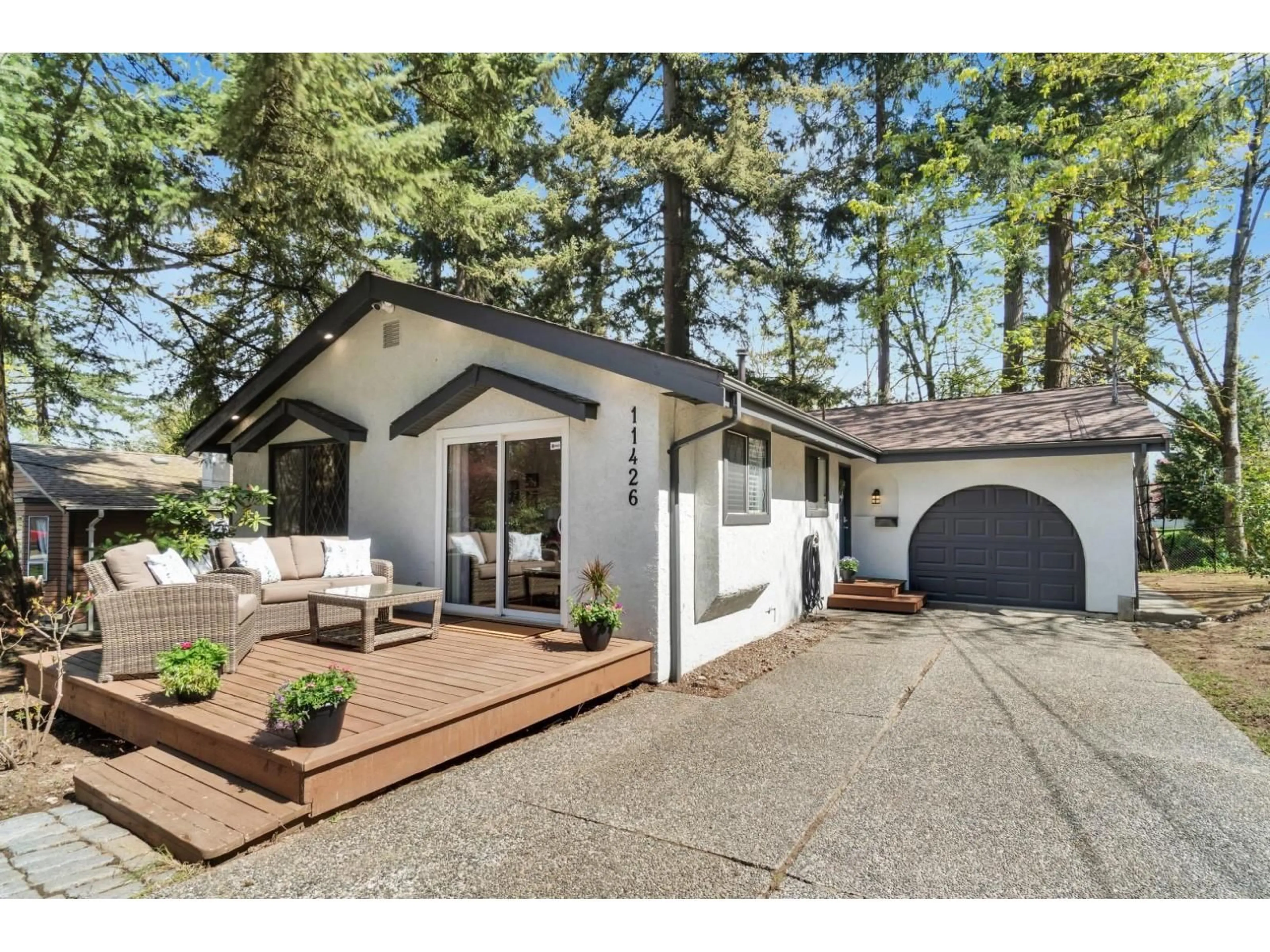 Home with vinyl exterior material, street for 11426 141A STREET, Surrey British Columbia V3R3K2