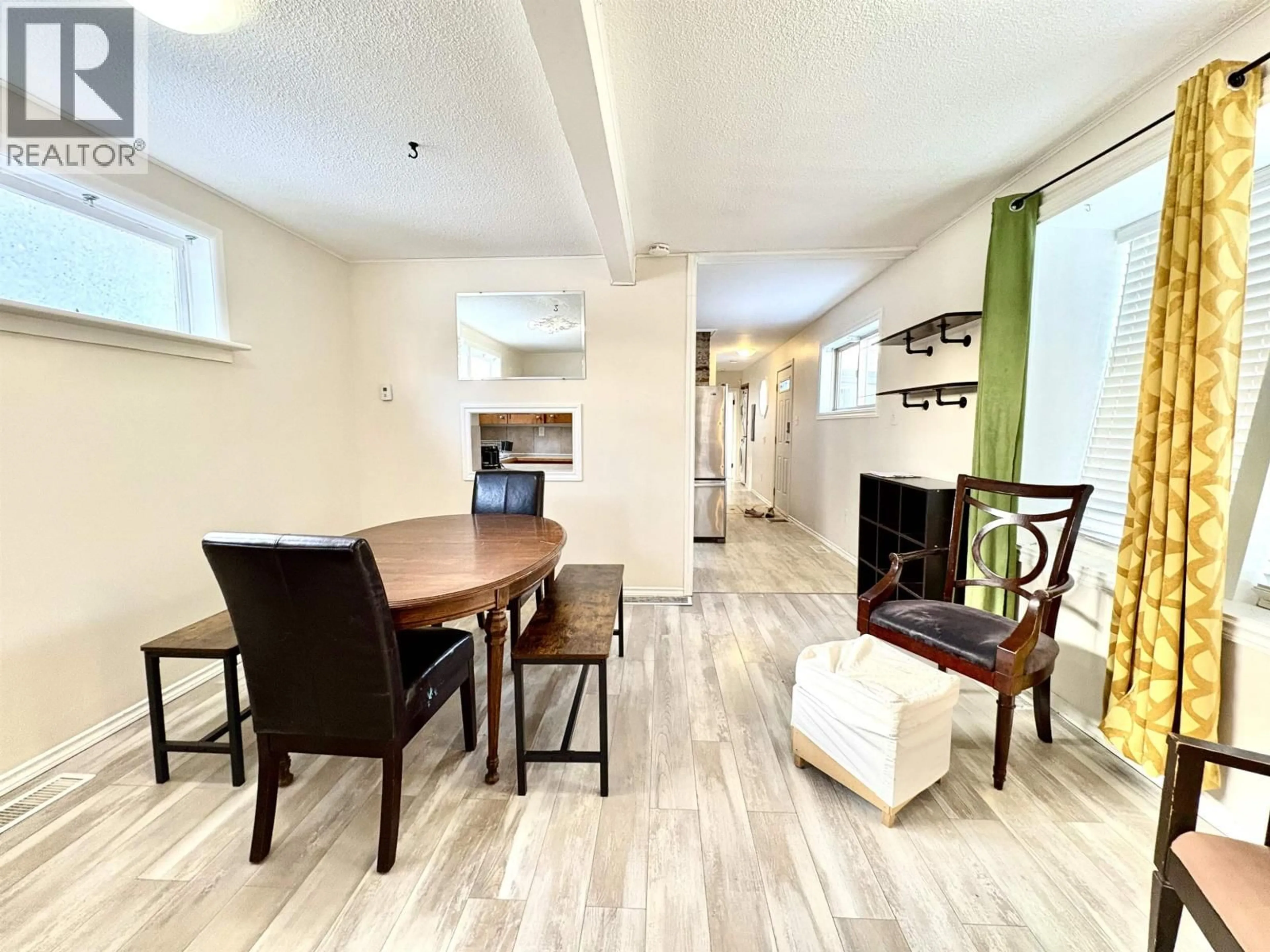 Living room with furniture, wood/laminate floor for 1909 MAPLE STREET, Prince George British Columbia V2L1X2