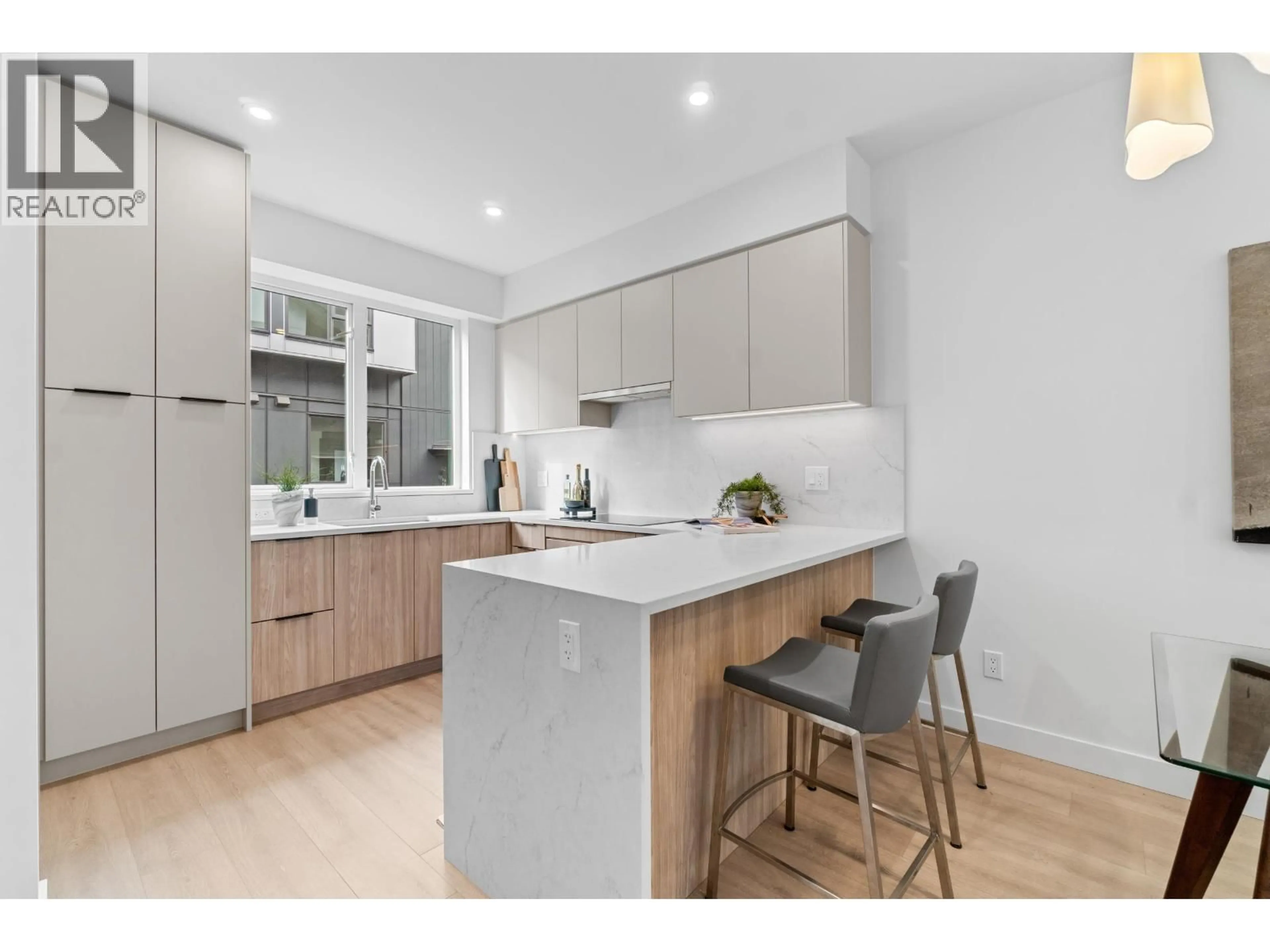 Open concept kitchen, wood/laminate floor for 203 - 7161 17TH AVENUE, Burnaby British Columbia V3N0K1