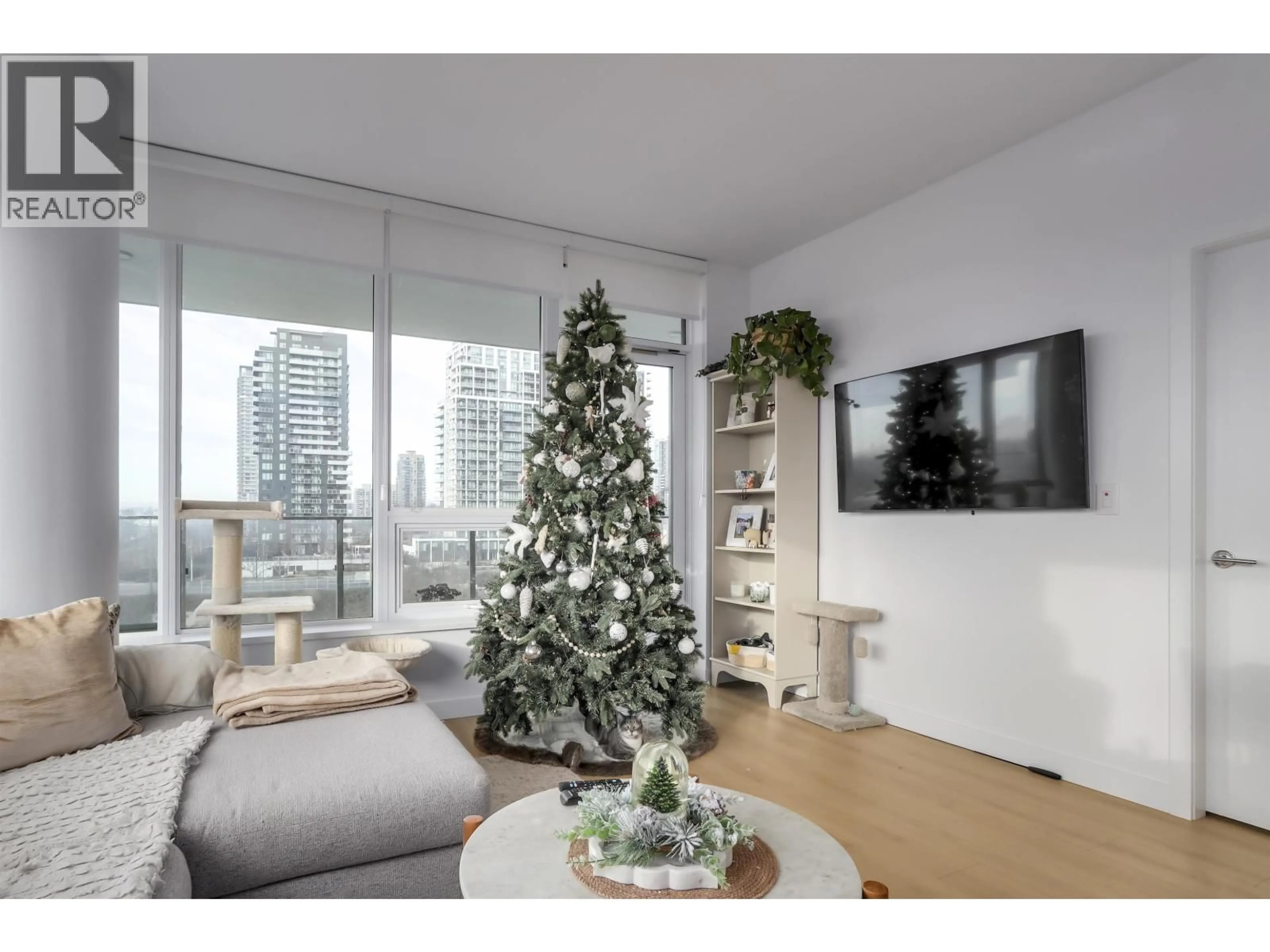 Living room with furniture, wood/laminate floor for 606 - 2425 ALPHA AVENUE, Burnaby British Columbia V5C0N6