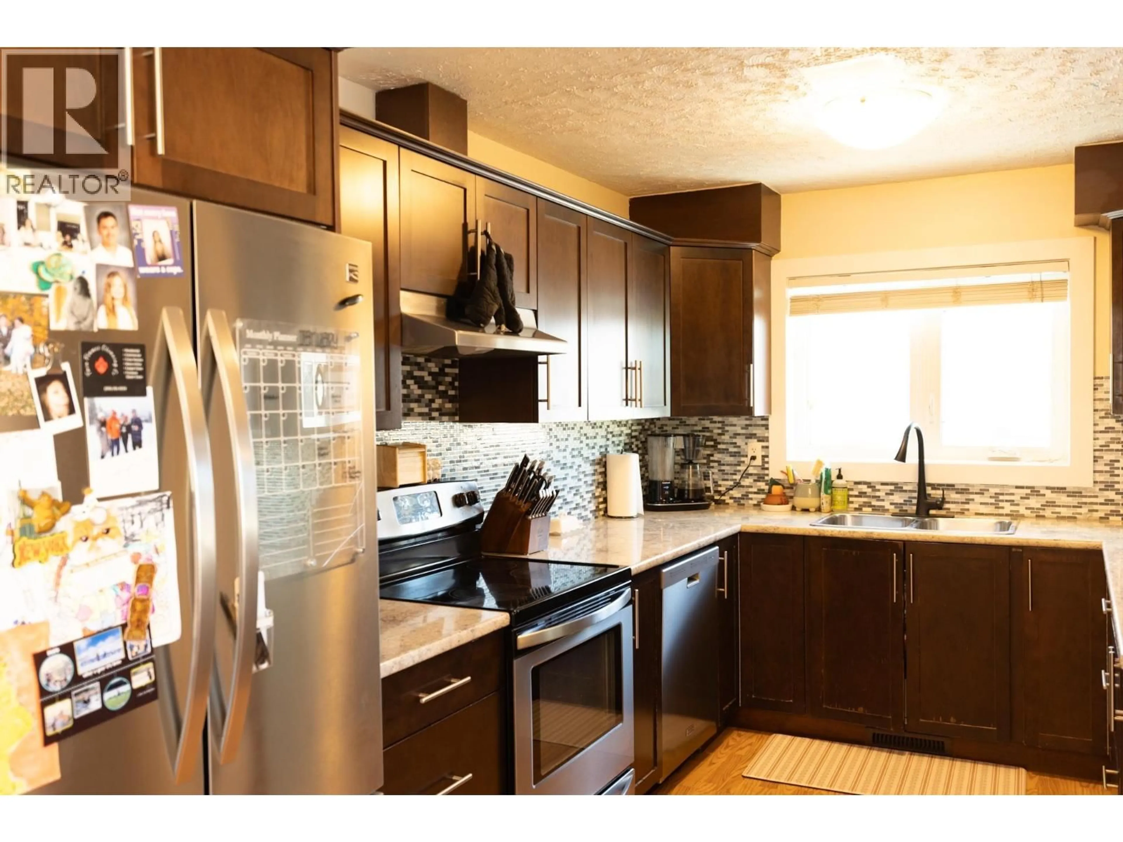 Standard kitchen, wood/laminate floor for 9716 104 AVENUE, Fort St. John British Columbia V1J2K2