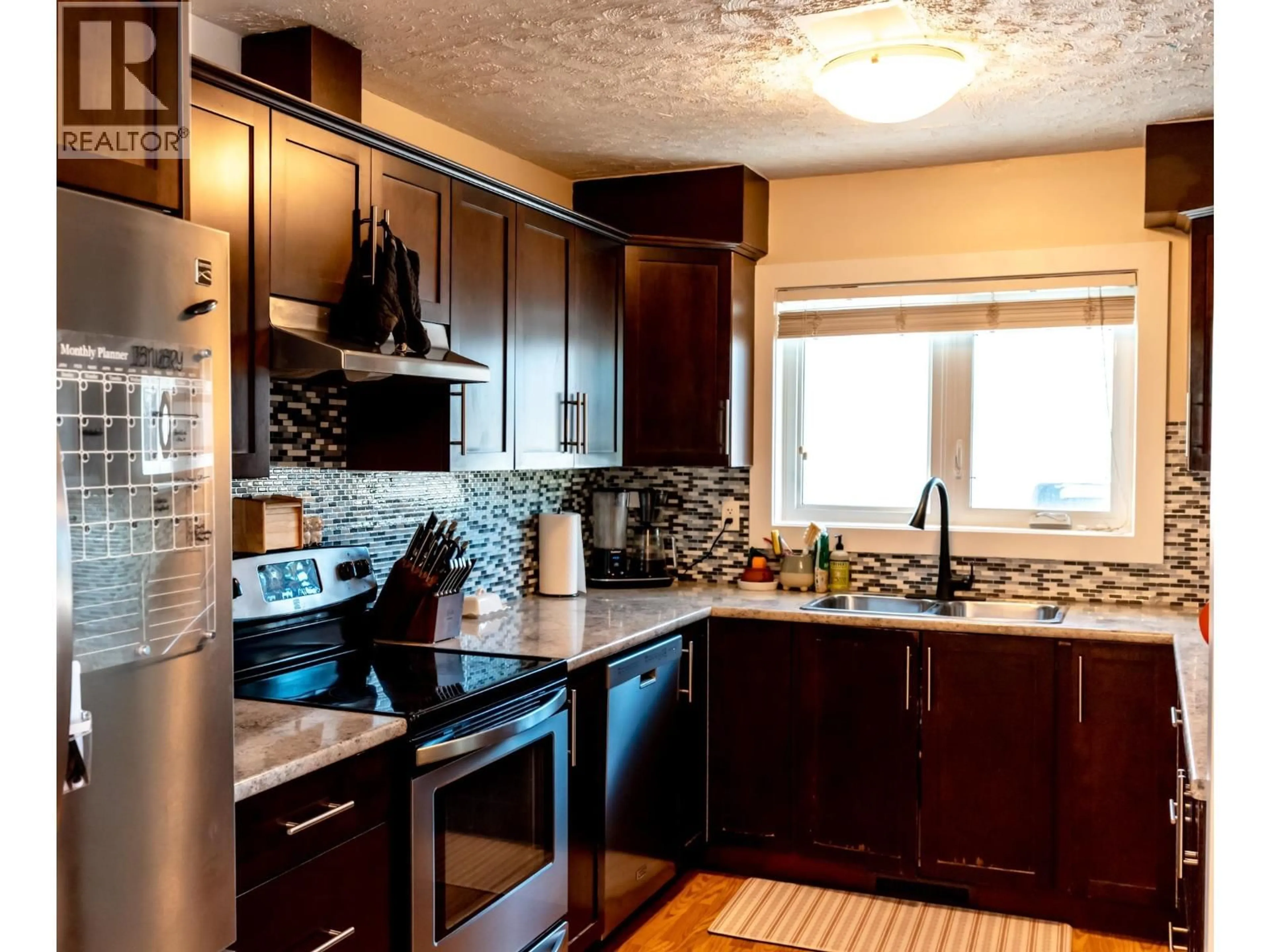 Standard kitchen, ceramic/tile floor for 9716 104 AVENUE, Fort St. John British Columbia V1J2K2