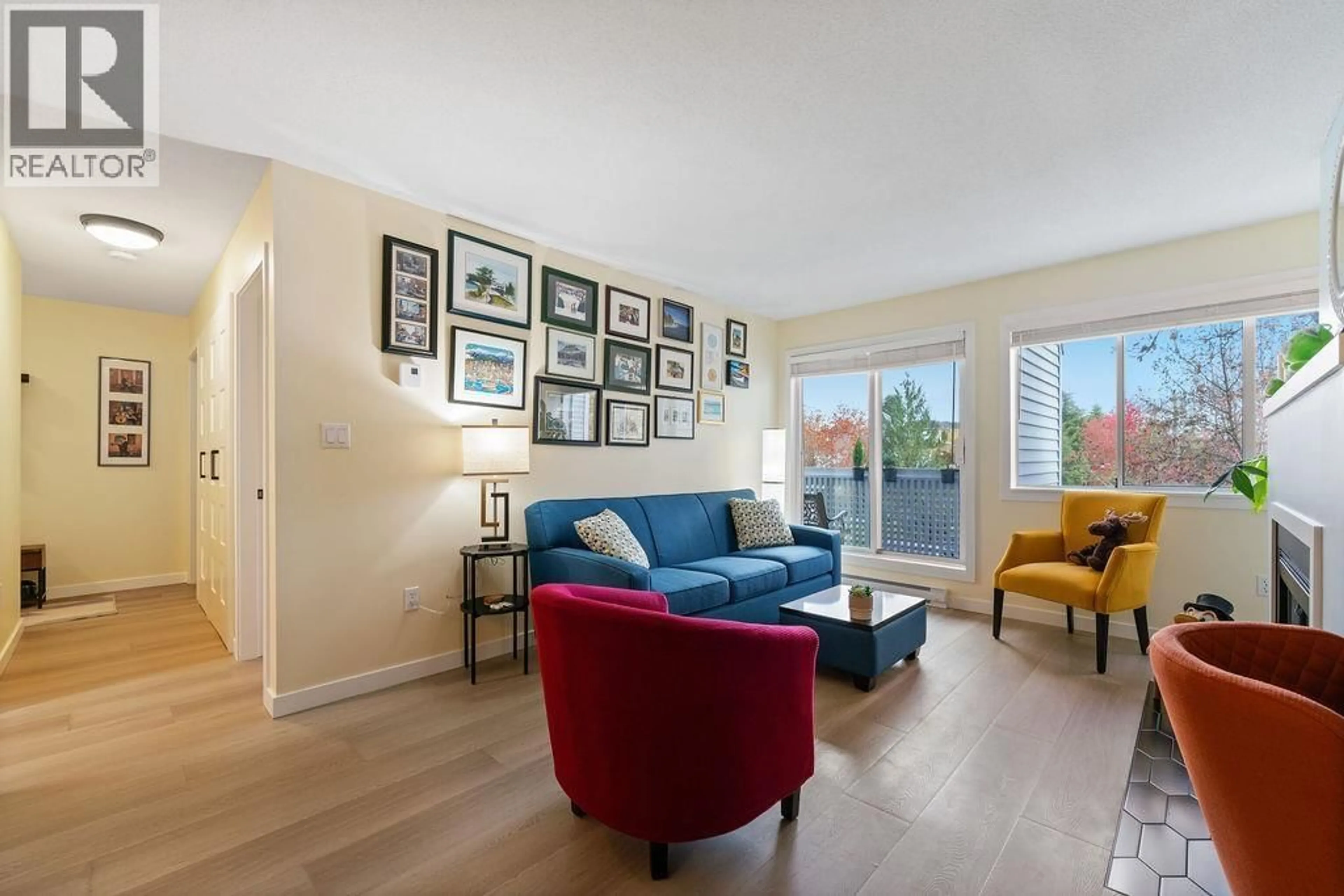 Living room with furniture, wood/laminate floor for 218 - 7751 MINORU BOULEVARD, Richmond British Columbia V6Y3G7