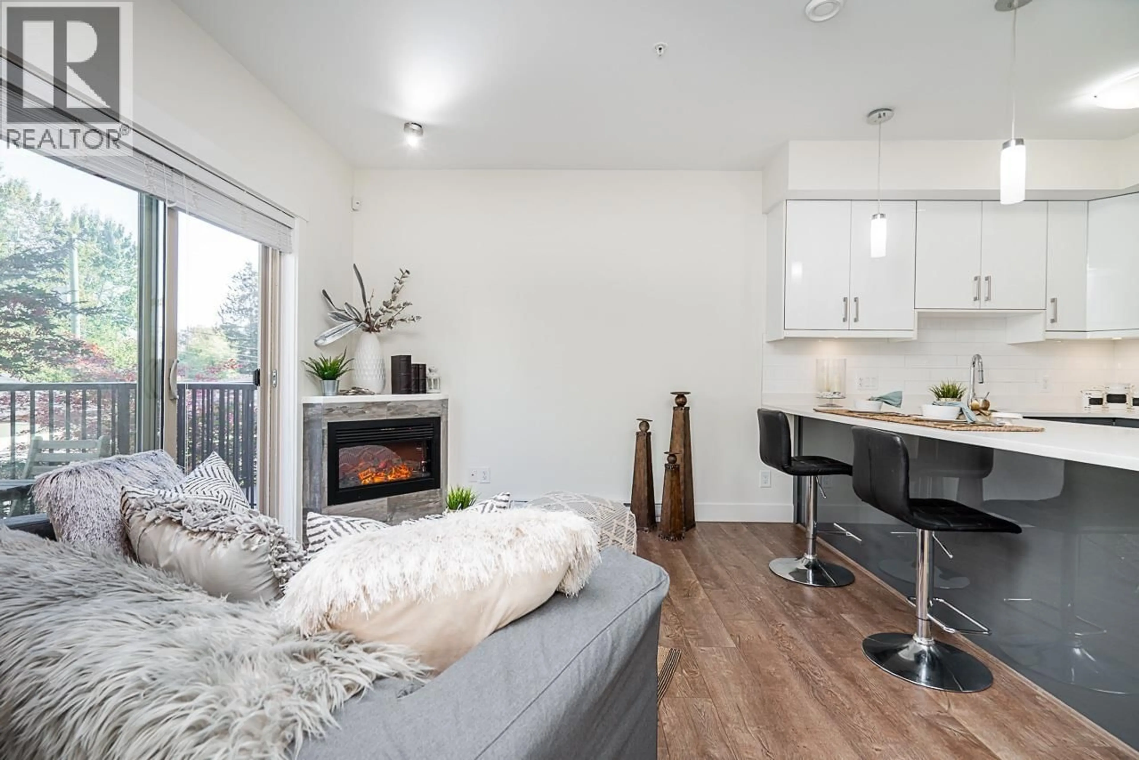 Living room with furniture, wood/laminate floor for 12 - 4033 DOMINION STREET, Burnaby British Columbia V5G0C2