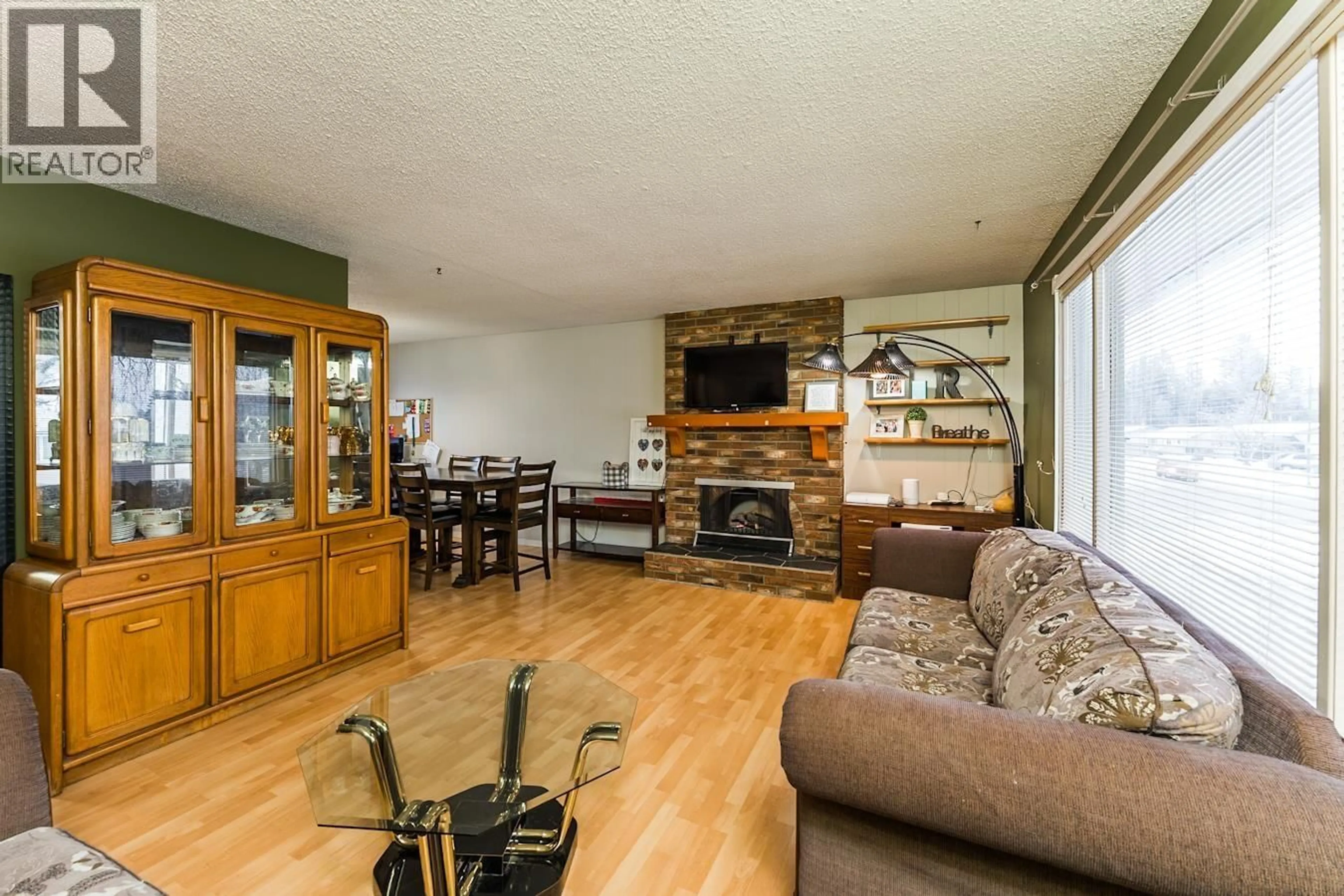 Living room with furniture, wood/laminate floor for 7386 IMPERIAL PLACE, Prince George British Columbia V2N2T9