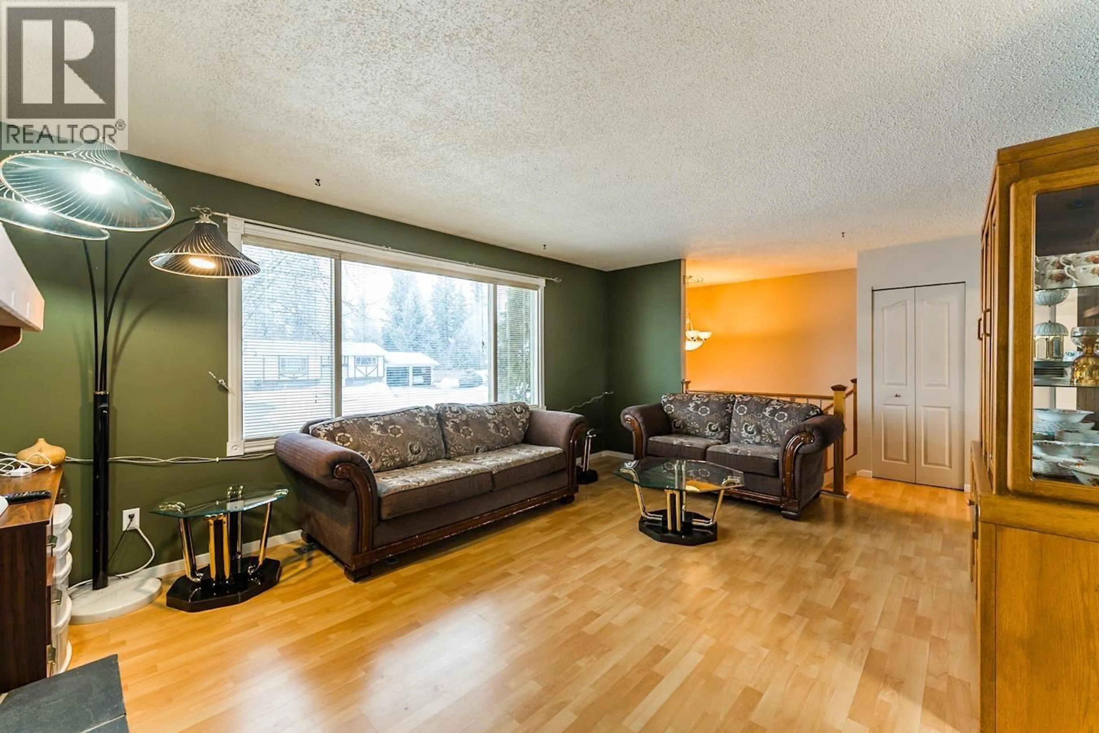 Living room with furniture, wood/laminate floor for 7386 IMPERIAL PLACE, Prince George British Columbia V2N2T9