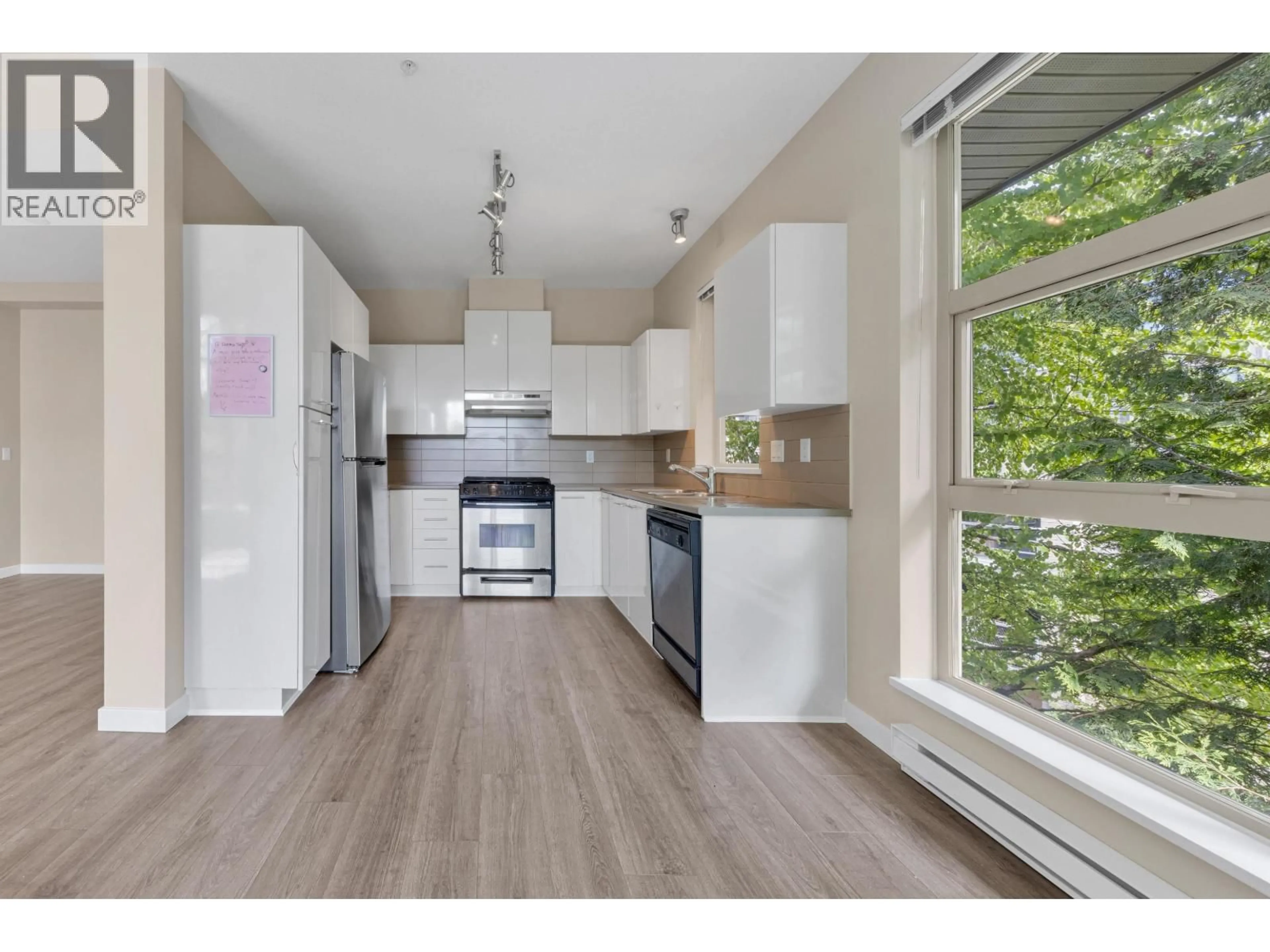 Open concept kitchen, wood/laminate floor for 414 - 9339 UNIVERSITY CRESCENT, Burnaby British Columbia V5A4Y1