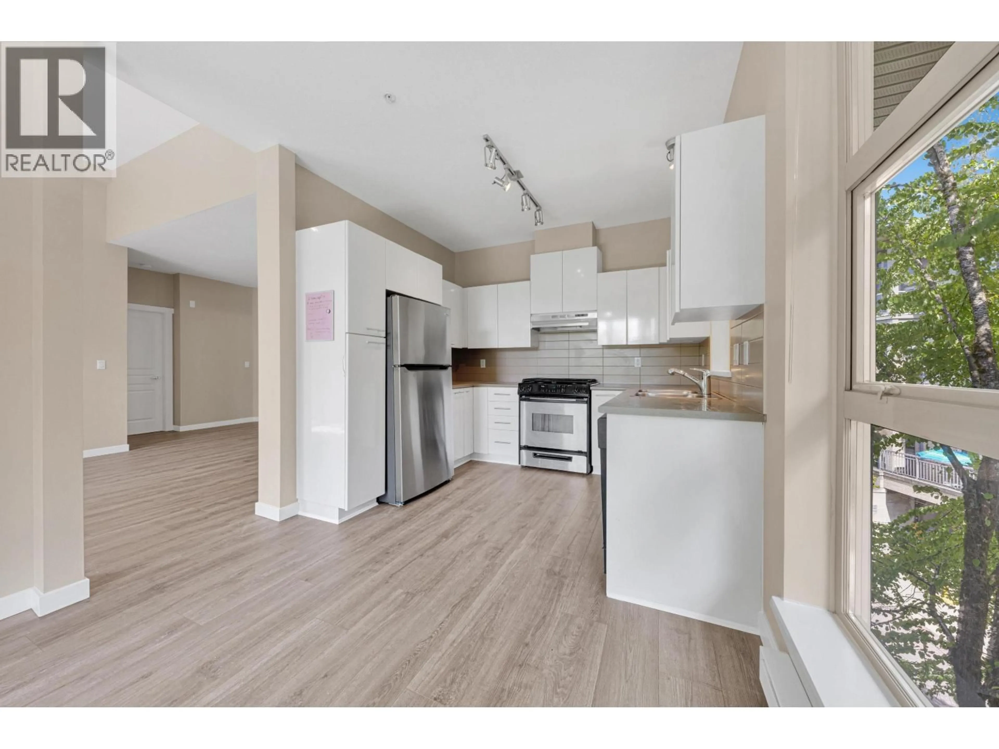 Open concept kitchen, wood/laminate floor for 414 - 9339 UNIVERSITY CRESCENT, Burnaby British Columbia V5A4Y1