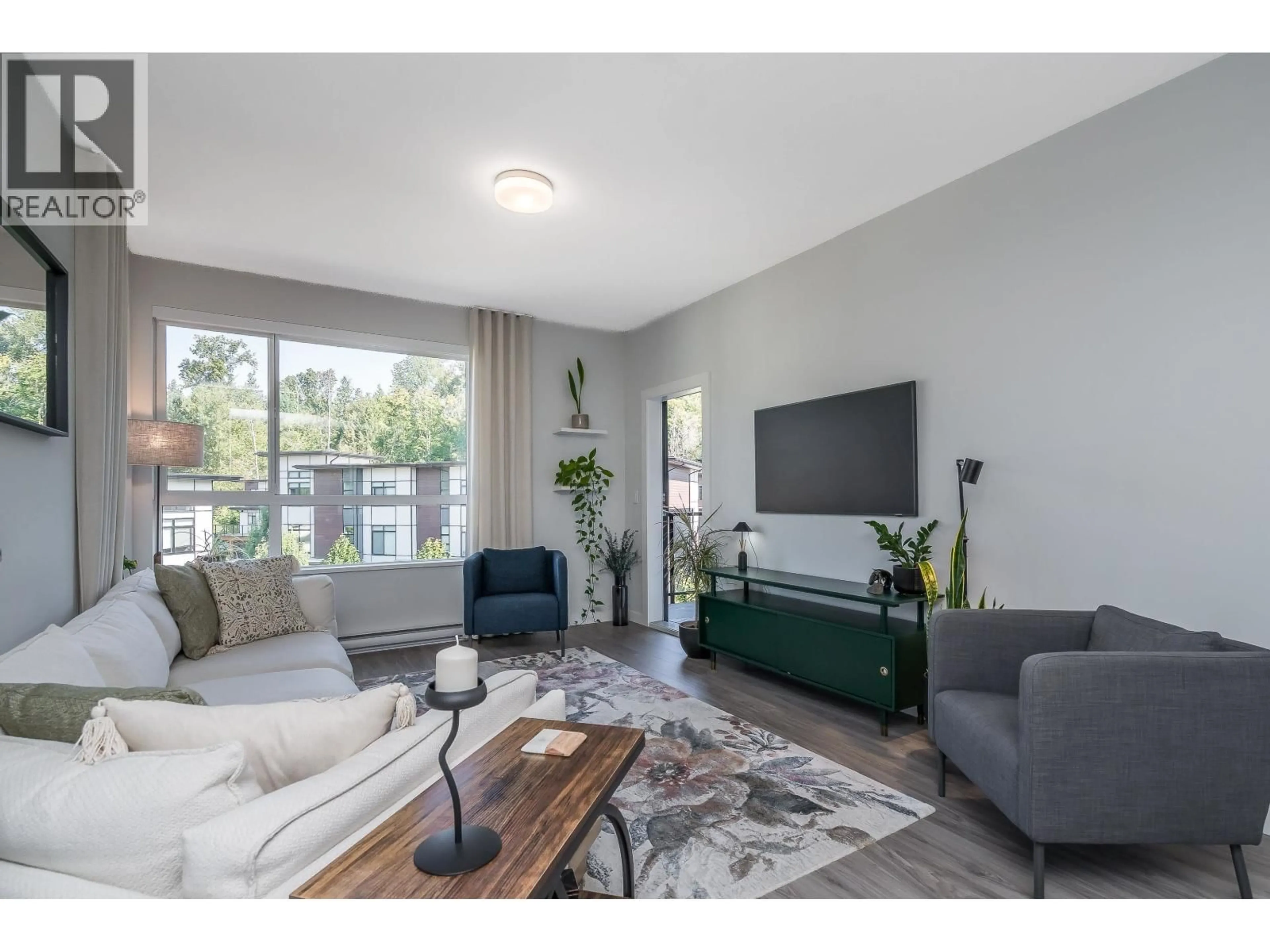 Living room with furniture, wood/laminate floor for 508 - 6438 BYRNEPARK DRIVE, Burnaby British Columbia V3N0A1