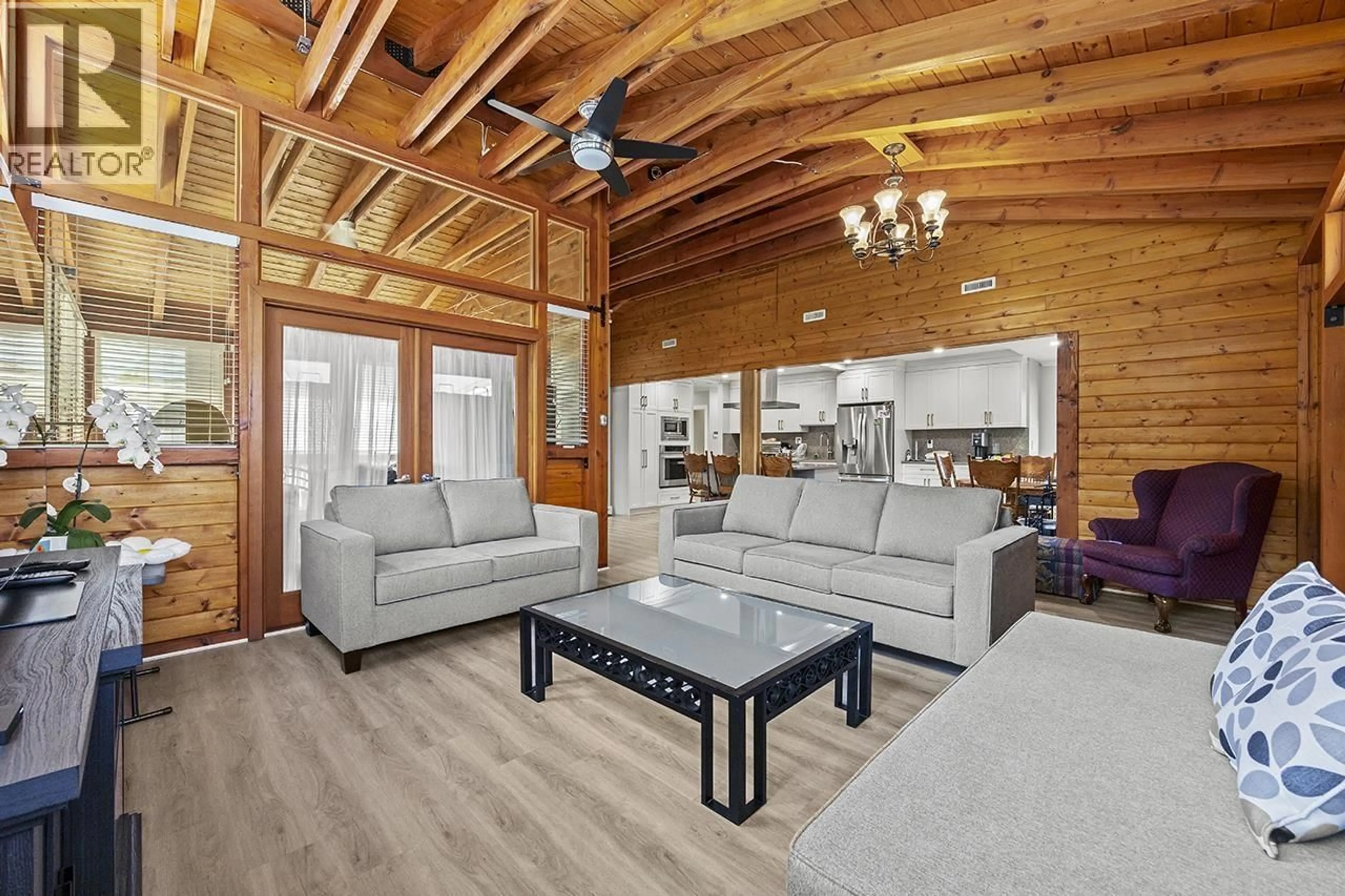 Living room with furniture, wood/laminate floor for 7983 SUNCREST DRIVE, Burnaby British Columbia V5J3N4