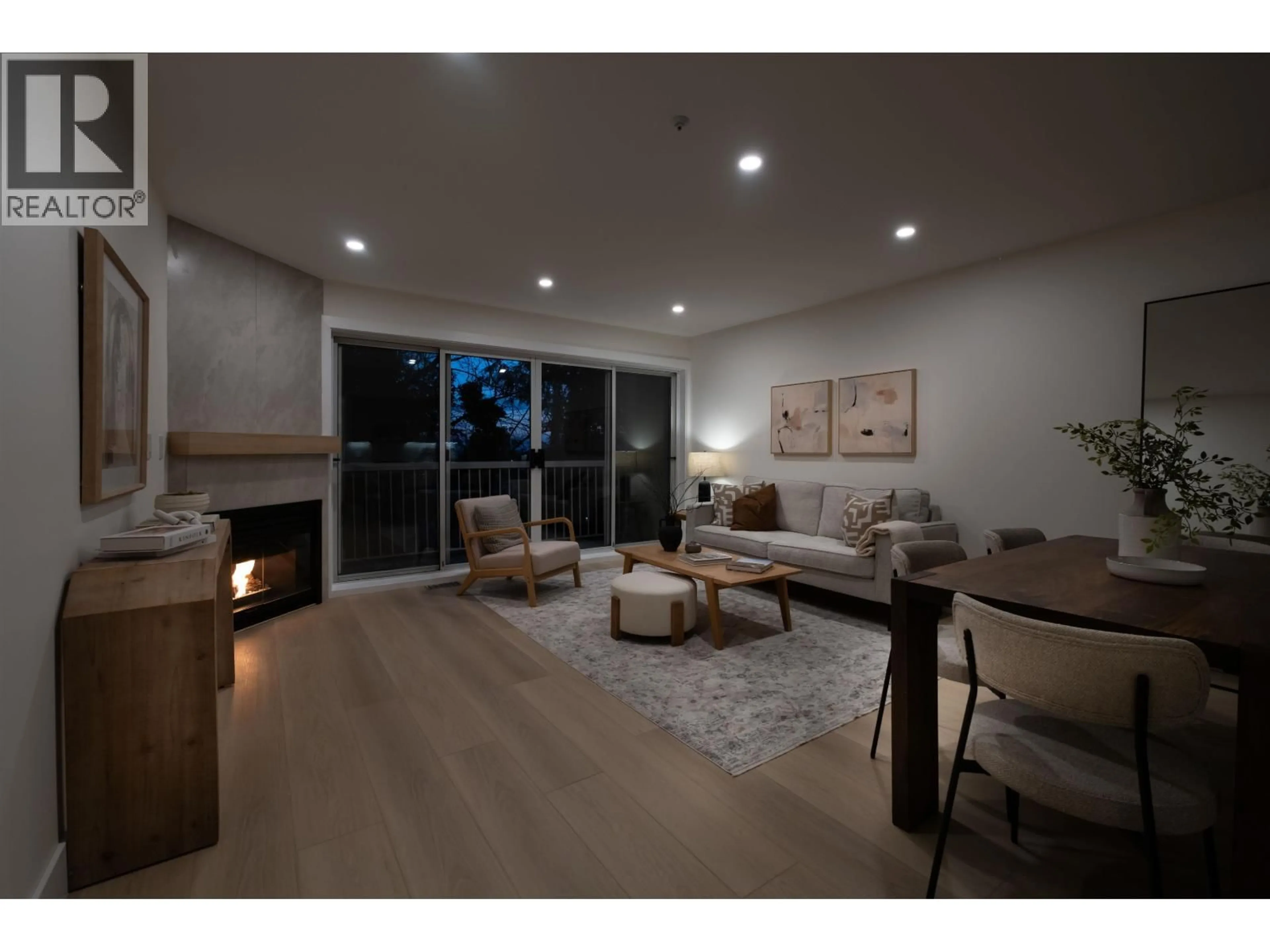 Living room with furniture, wood/laminate floor for 3350 COBBLESTONE AVENUE, Vancouver British Columbia V5S4S4