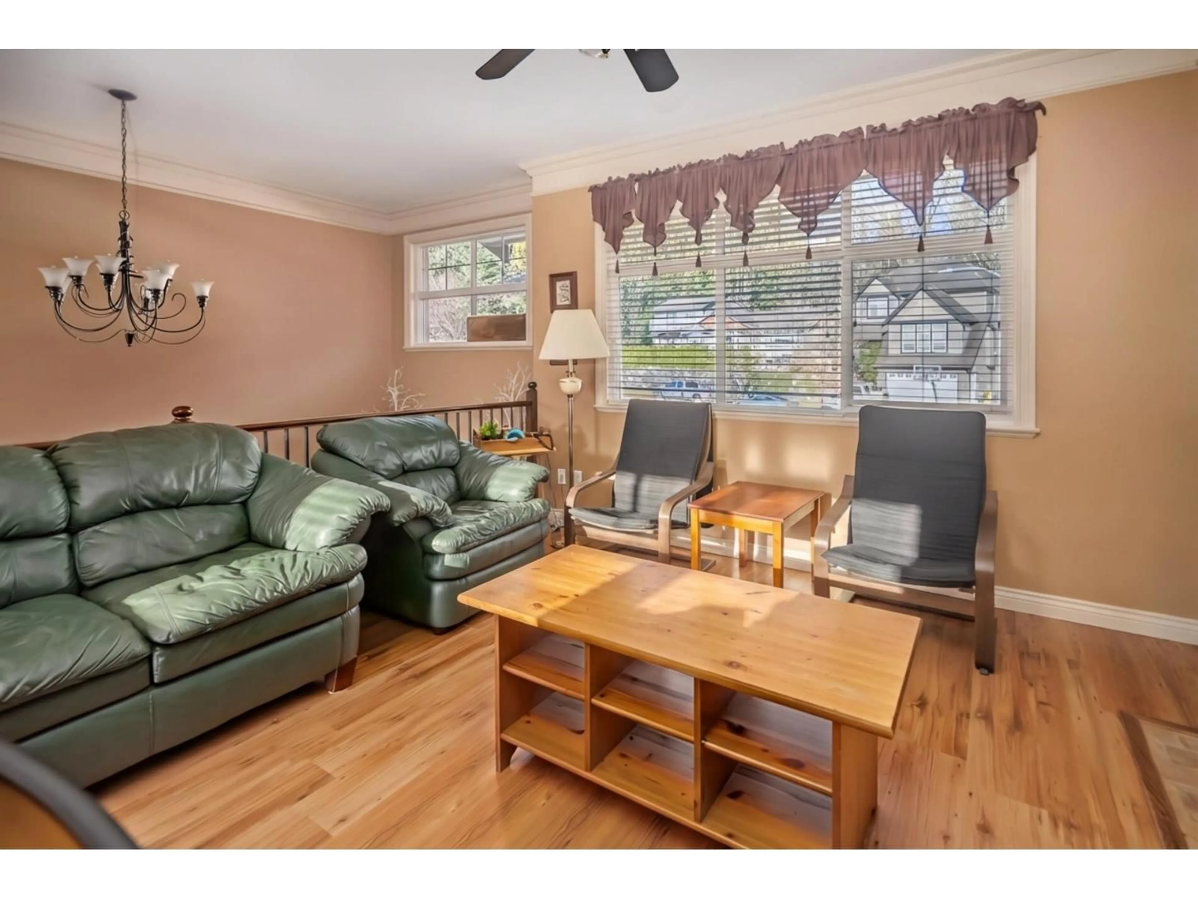 Living room with furniture, wood/laminate floor for 34740 FENMO PLACE, Mission British Columbia V2V7N6