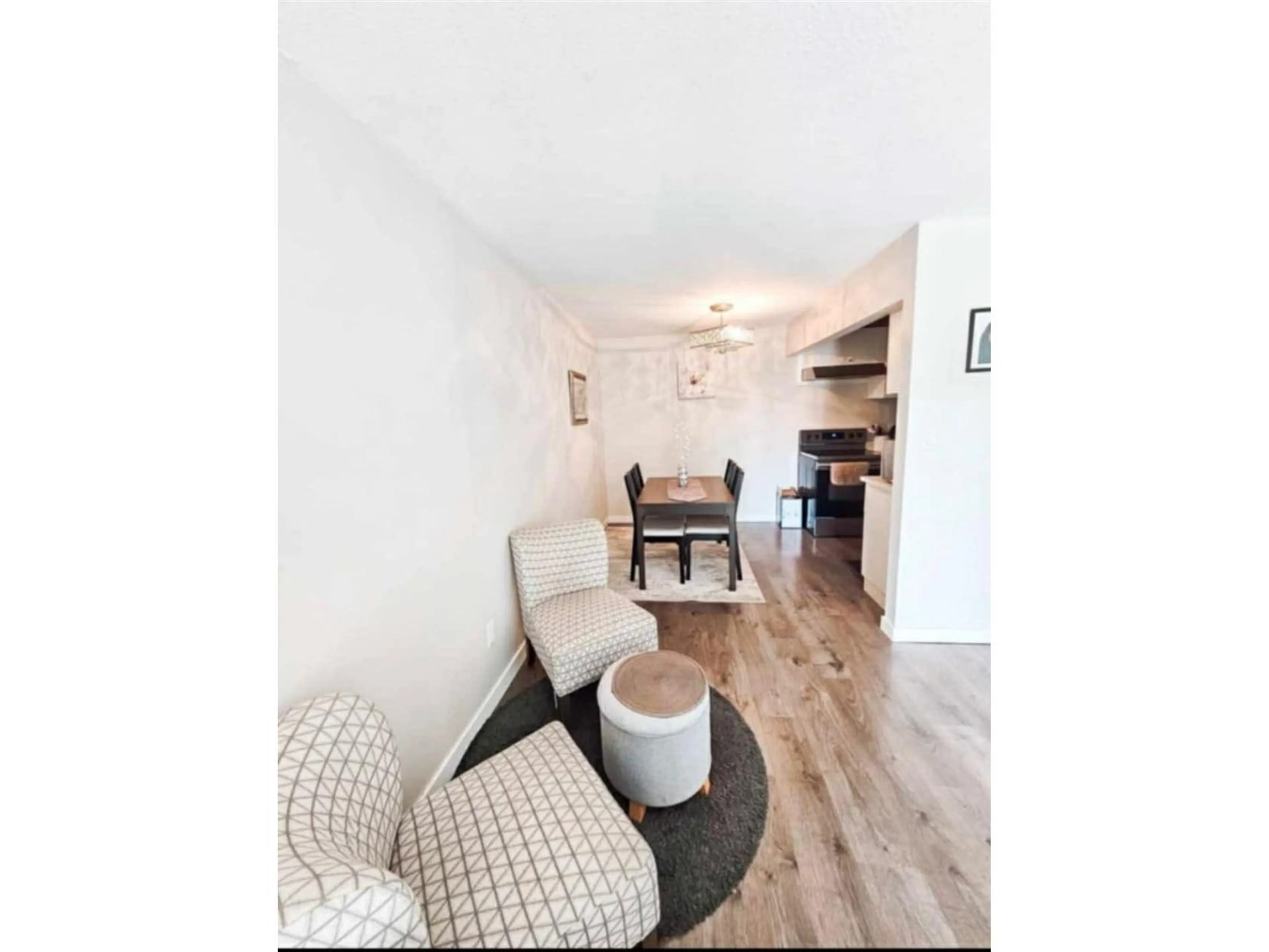 Living room with furniture, wood/laminate floor for 206 - 10438 148 STREET, Surrey British Columbia V3R8S9