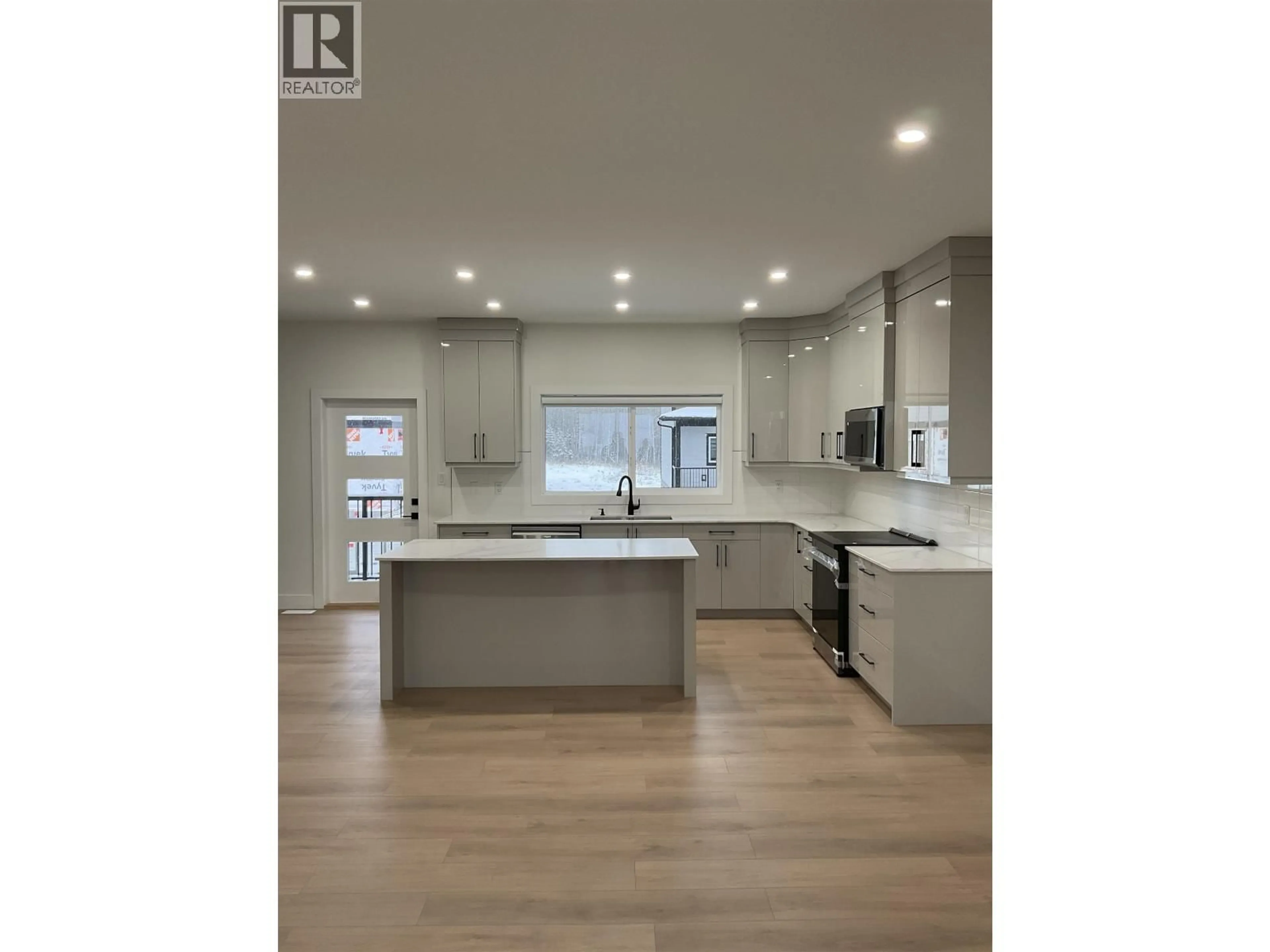 Open concept kitchen, wood/laminate floor for 1302 - 2395 ROWE STREET, Prince George British Columbia V2N0K5