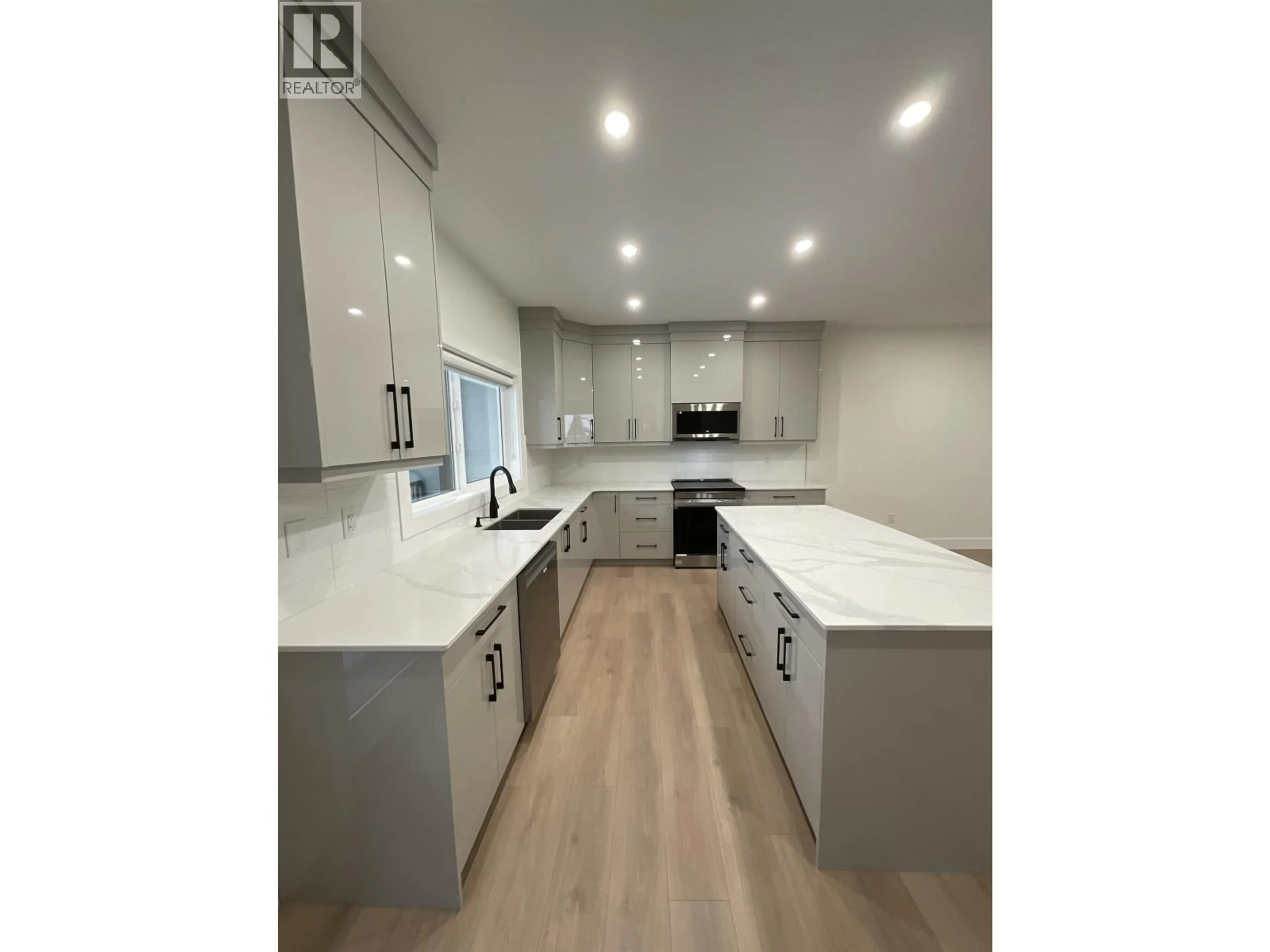 Open concept kitchen, wood/laminate floor for 1302 - 2395 ROWE STREET, Prince George British Columbia V2N0K5