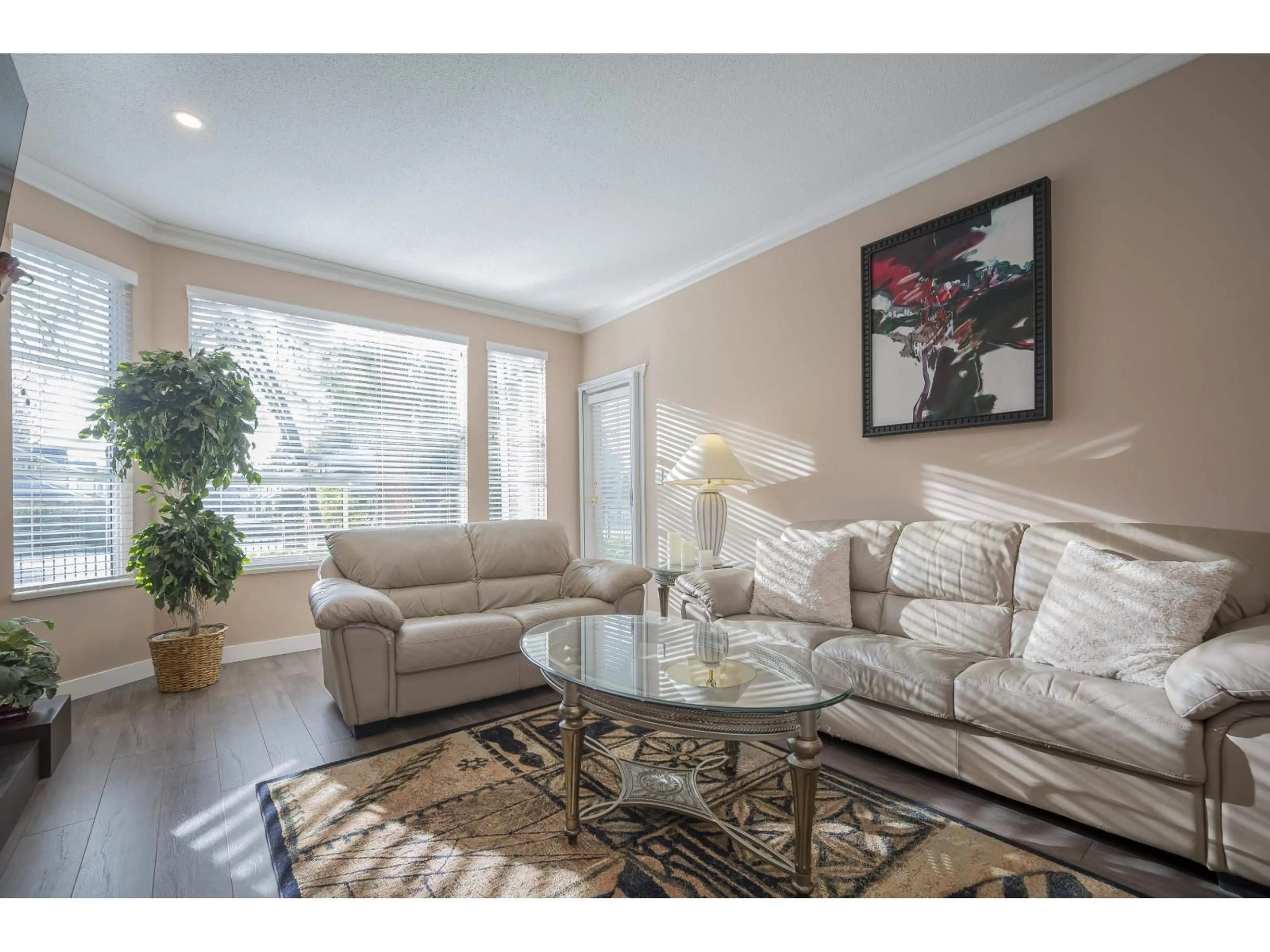 Living room with furniture, wood/laminate floor for 17 - 10038 150 STREET, Surrey British Columbia V3R0M8