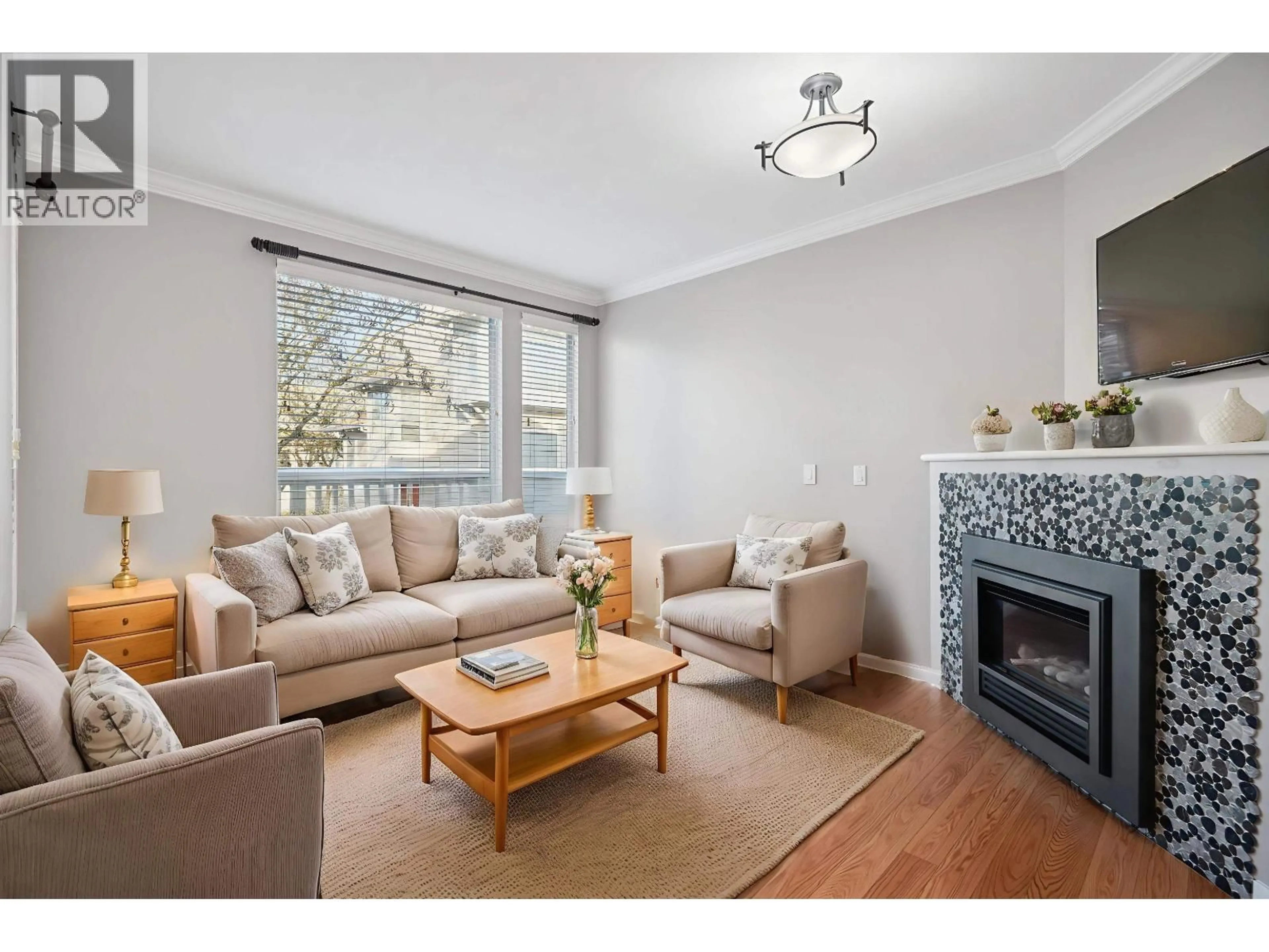 Living room with furniture, wood/laminate floor for 9 - 12900 JACK BELL DRIVE, Richmond British Columbia V6V2V8