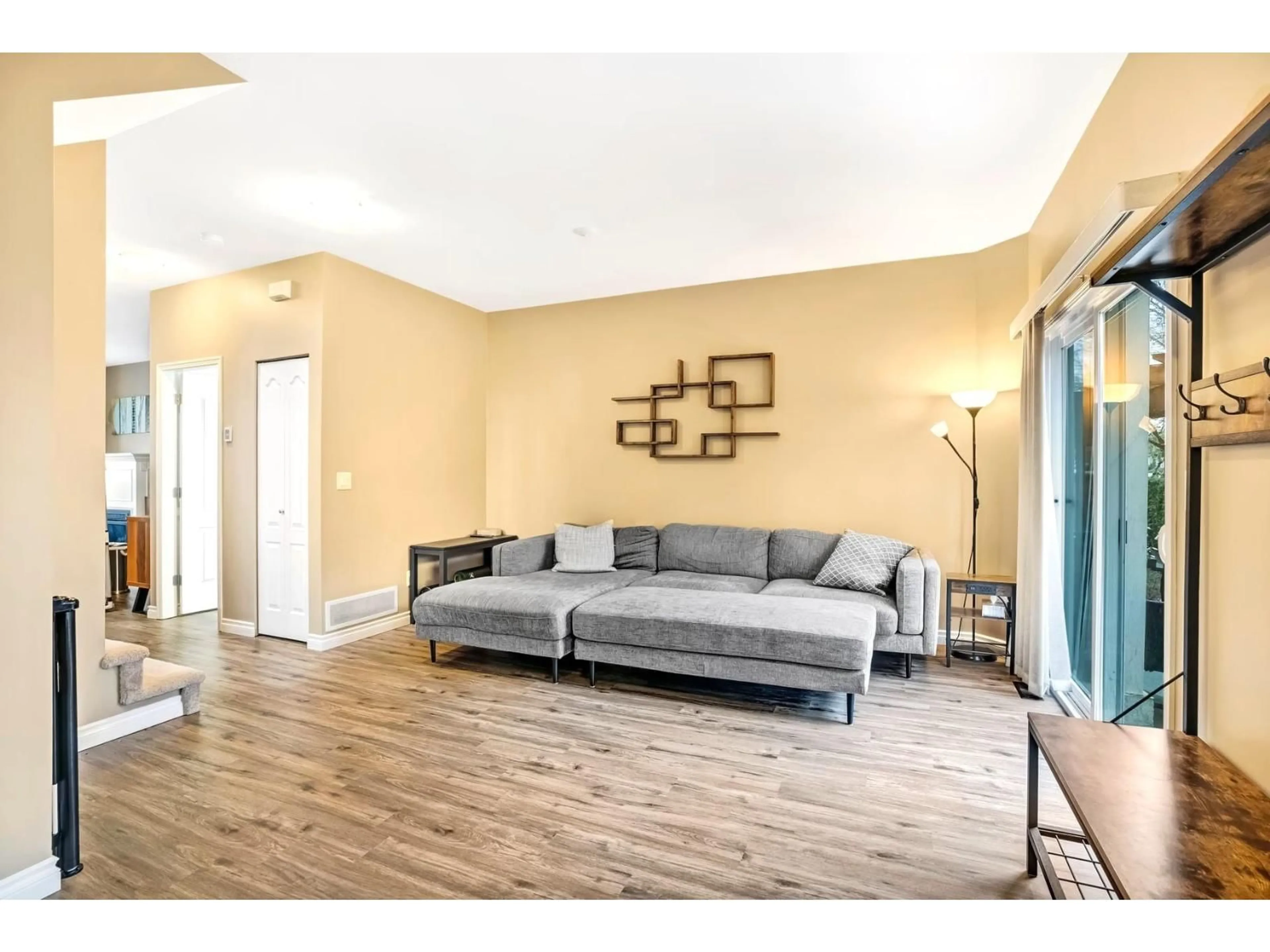 Living room with furniture, wood/laminate floor for 5 - 6588 188 STREET, Surrey British Columbia V3S1Z6