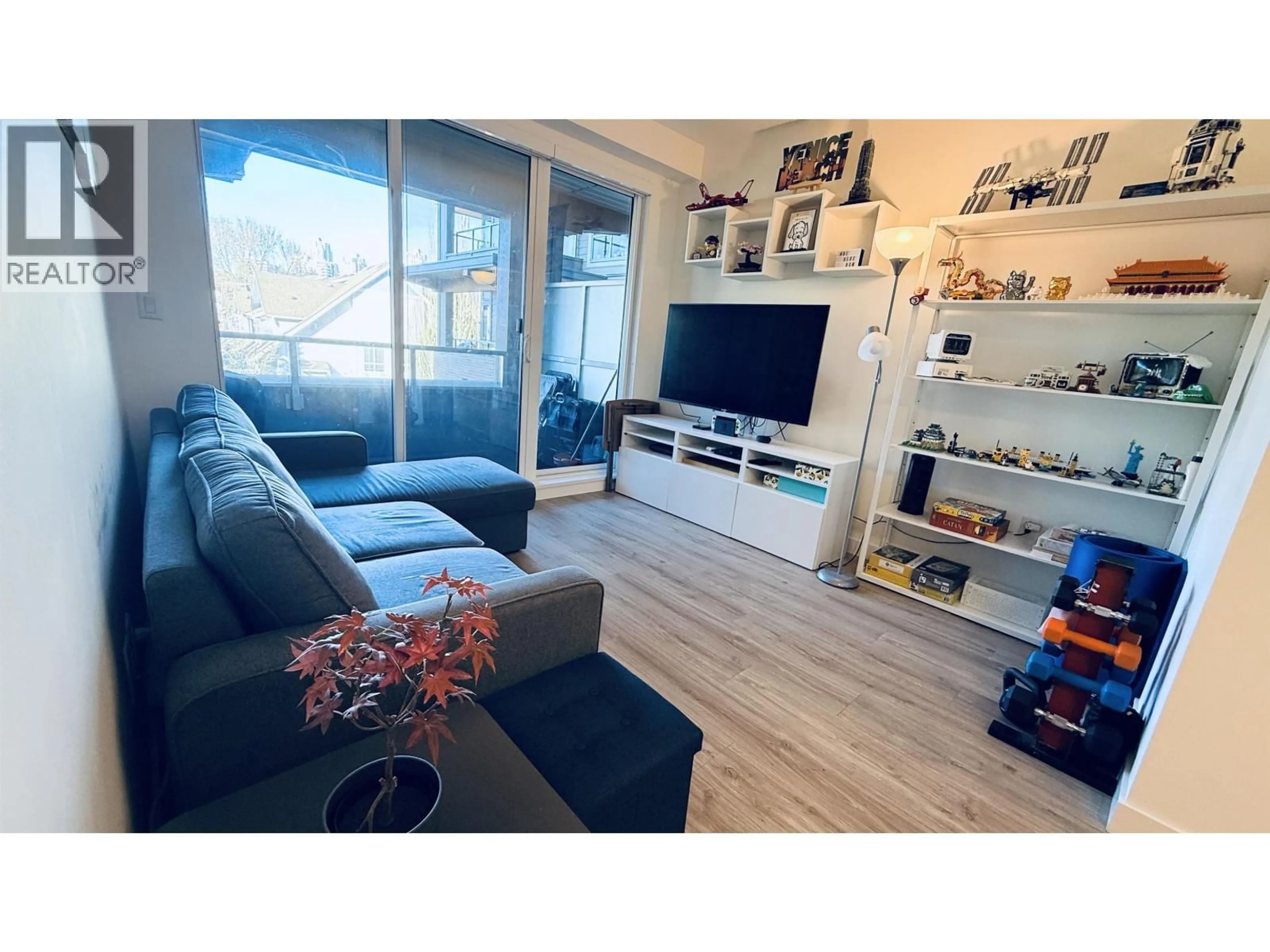 Living room with furniture, wood/laminate floor for 322 - 7133 14TH AVENUE, Burnaby British Columbia V3N0H5