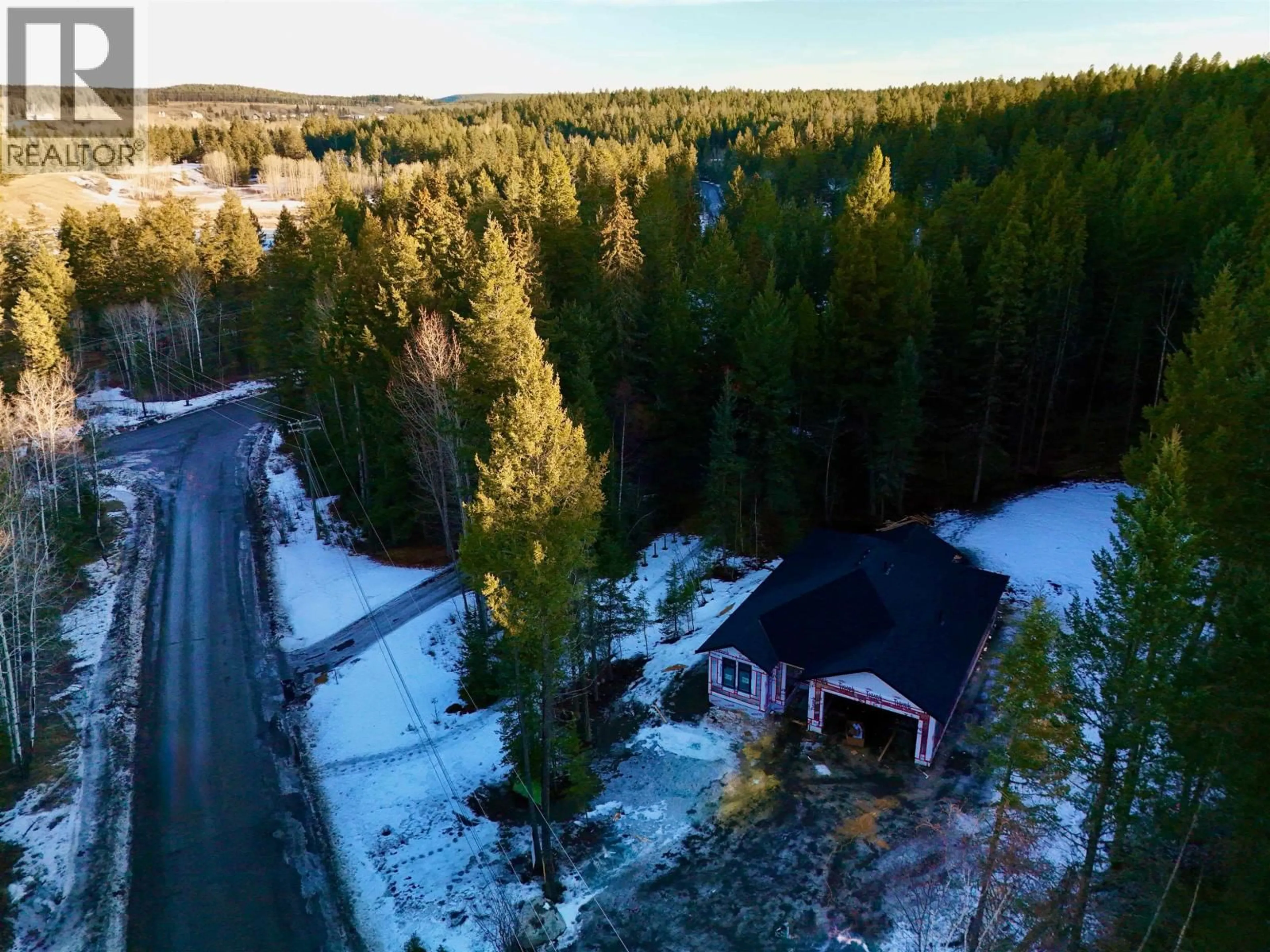 A pic from outside/outdoor area/front of a property/back of a property/a pic from drone, forest/trees view for 5336 THOMPSON ROAD, 108 Mile Ranch British Columbia V0K2Z0