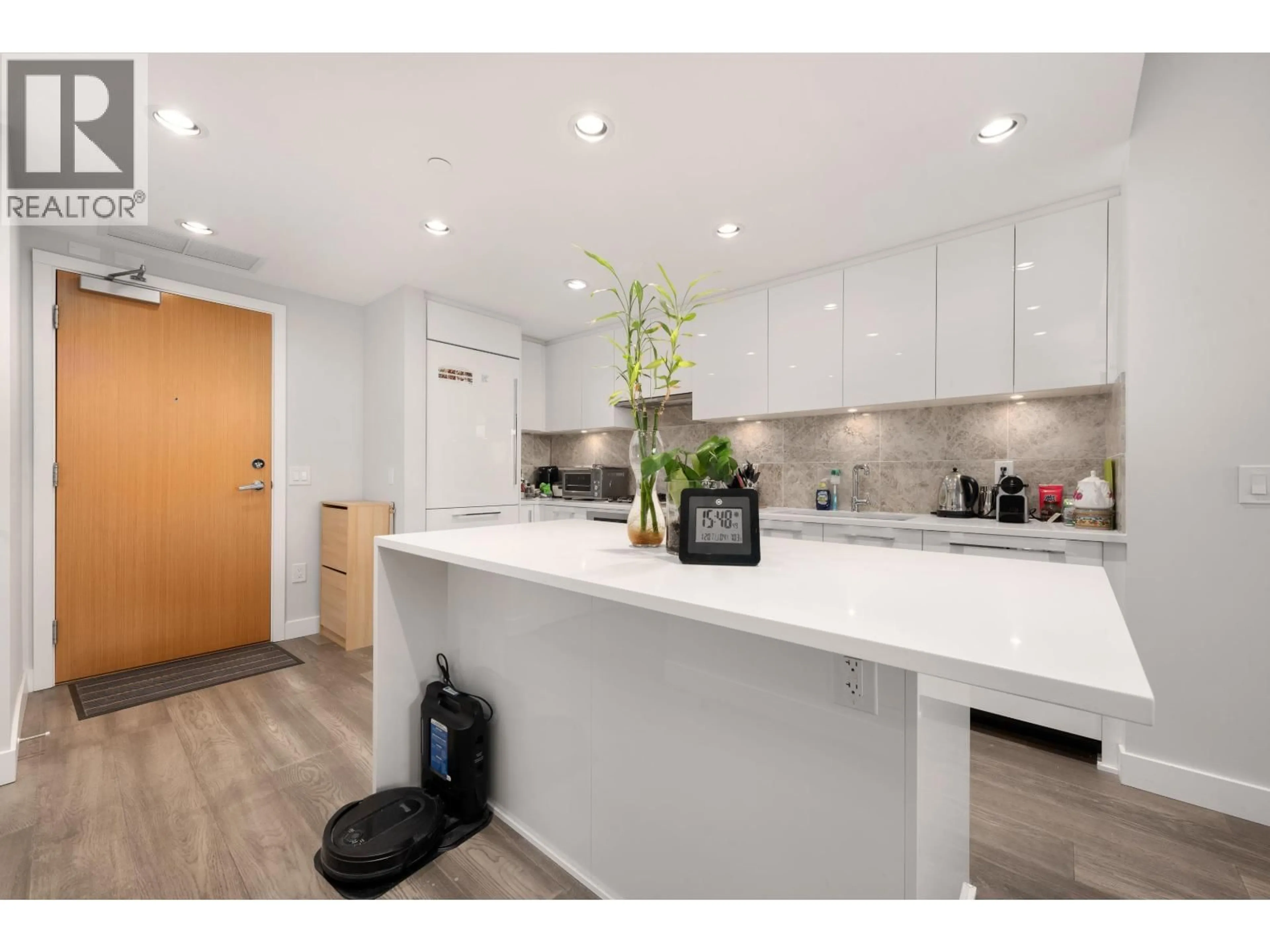 Open concept kitchen, wood/laminate floor for 1303 - 5410 SHORTCUT ROAD, Vancouver British Columbia V6T0C8