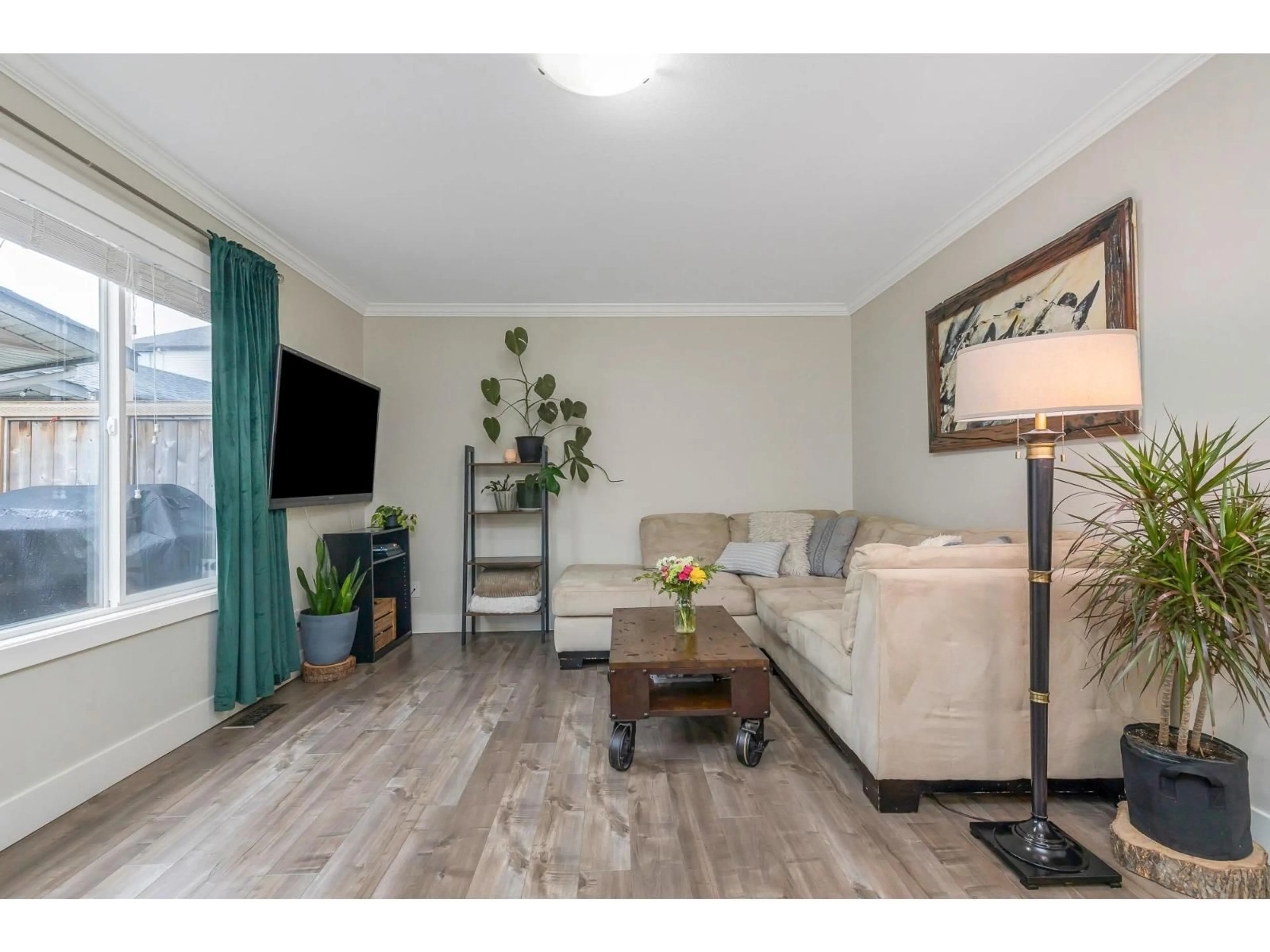 Living room with furniture, wood/laminate floor for 29 - 5648 VEDDER ROAD, Chilliwack British Columbia V2R3M8