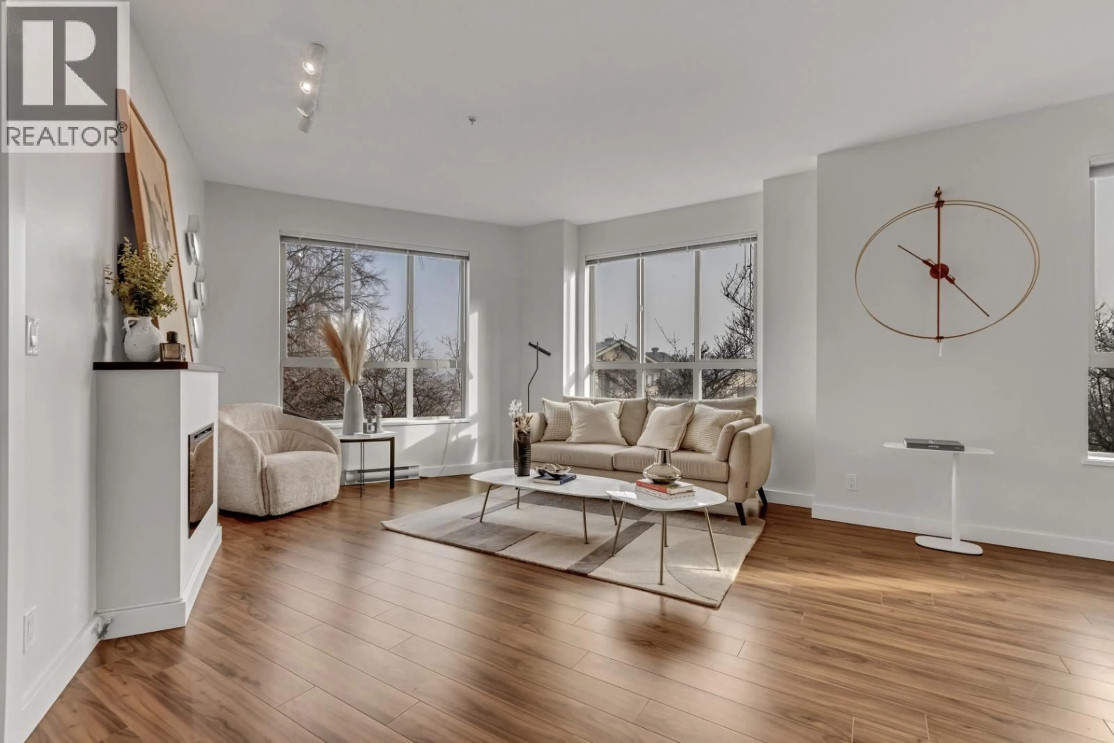 Living room with furniture, wood/laminate floor for 201 - 250 FRANCIS WAY, New Westminster British Columbia V3L0E6