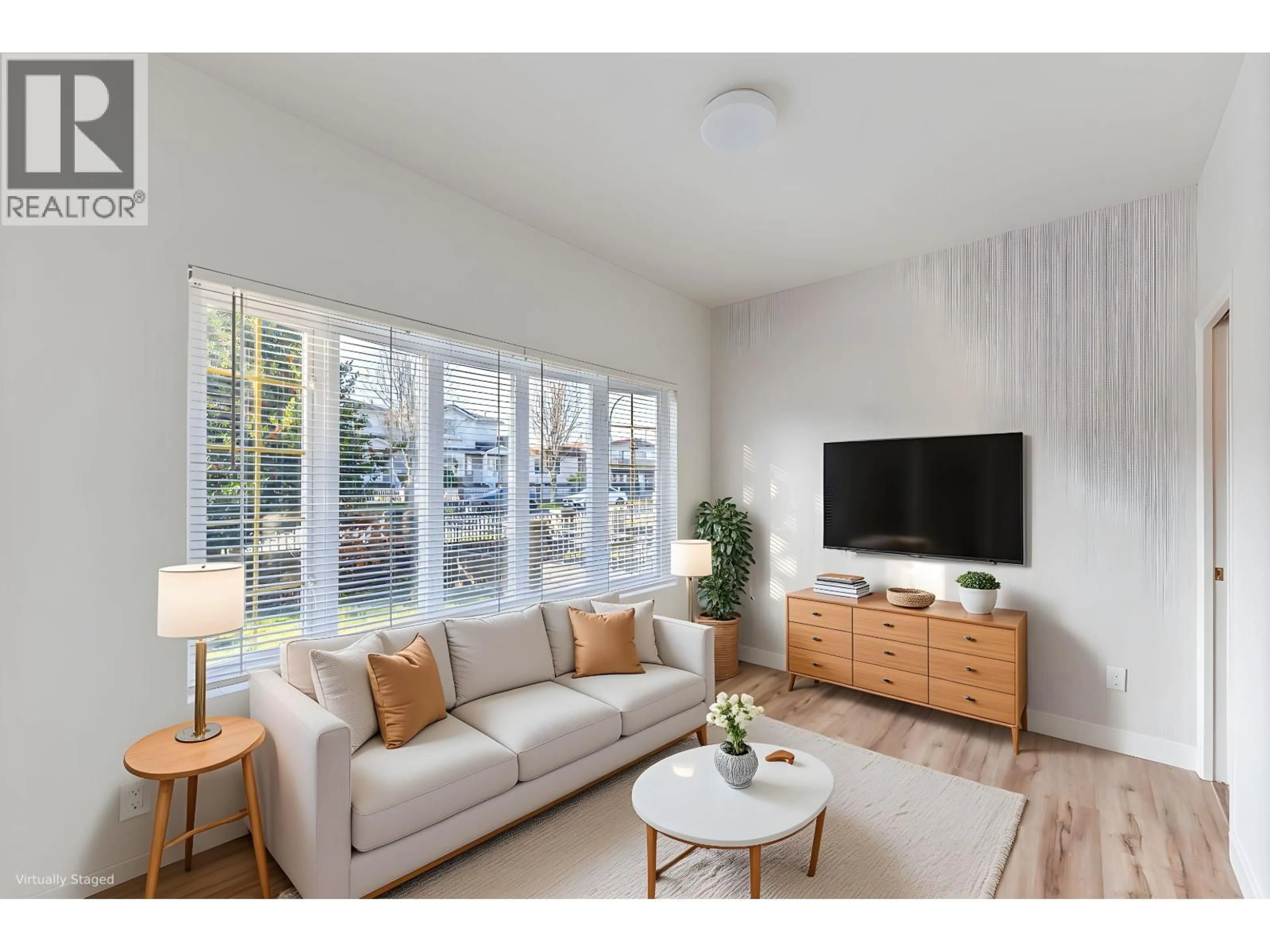 Living room with furniture, wood/laminate floor for 6586 NANAIMO STREET, Vancouver British Columbia V5P4L2