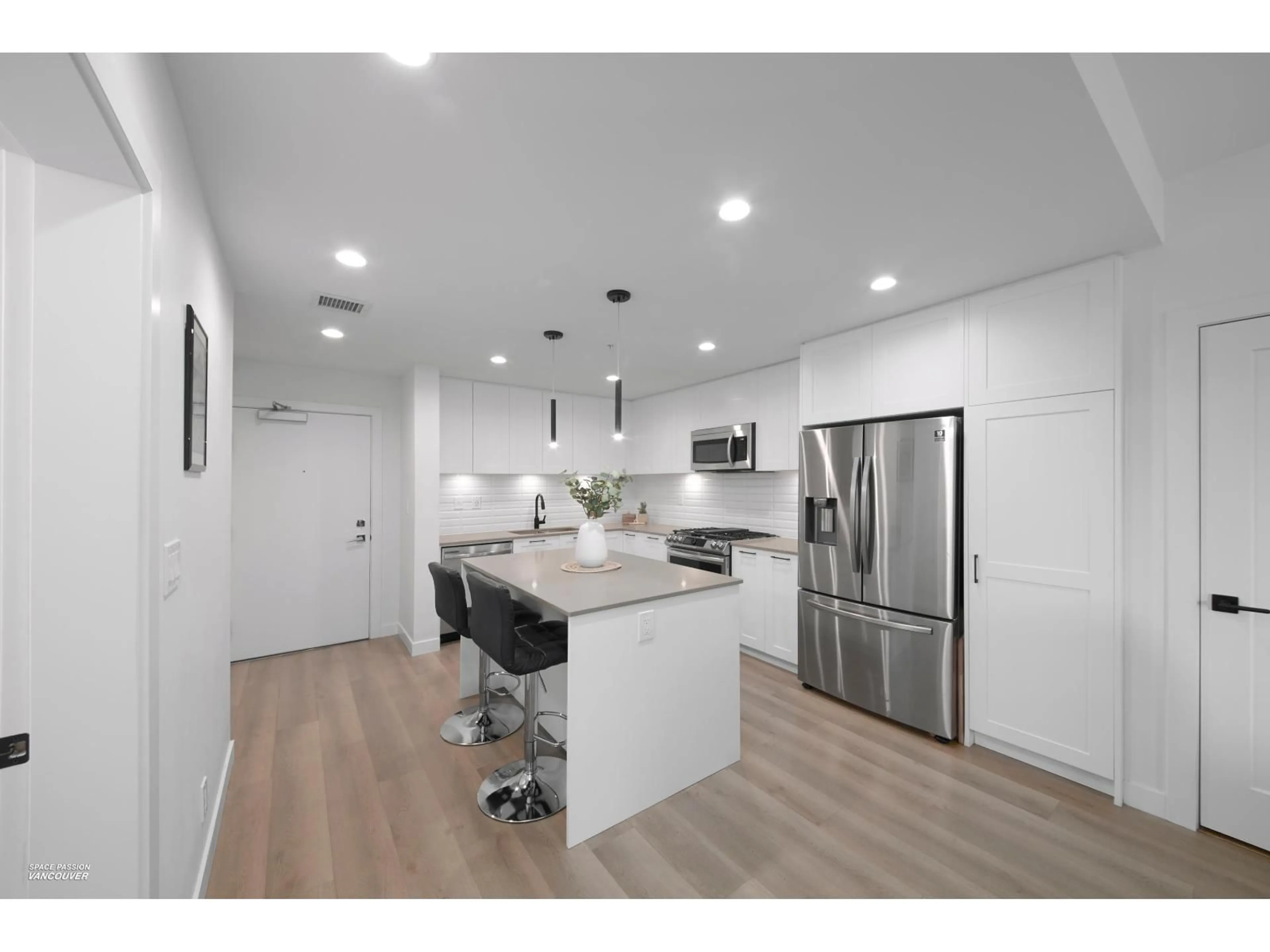 Open concept kitchen, wood/laminate floor for A206 - 20018 83A AVENUE, Langley British Columbia V2Y3P2