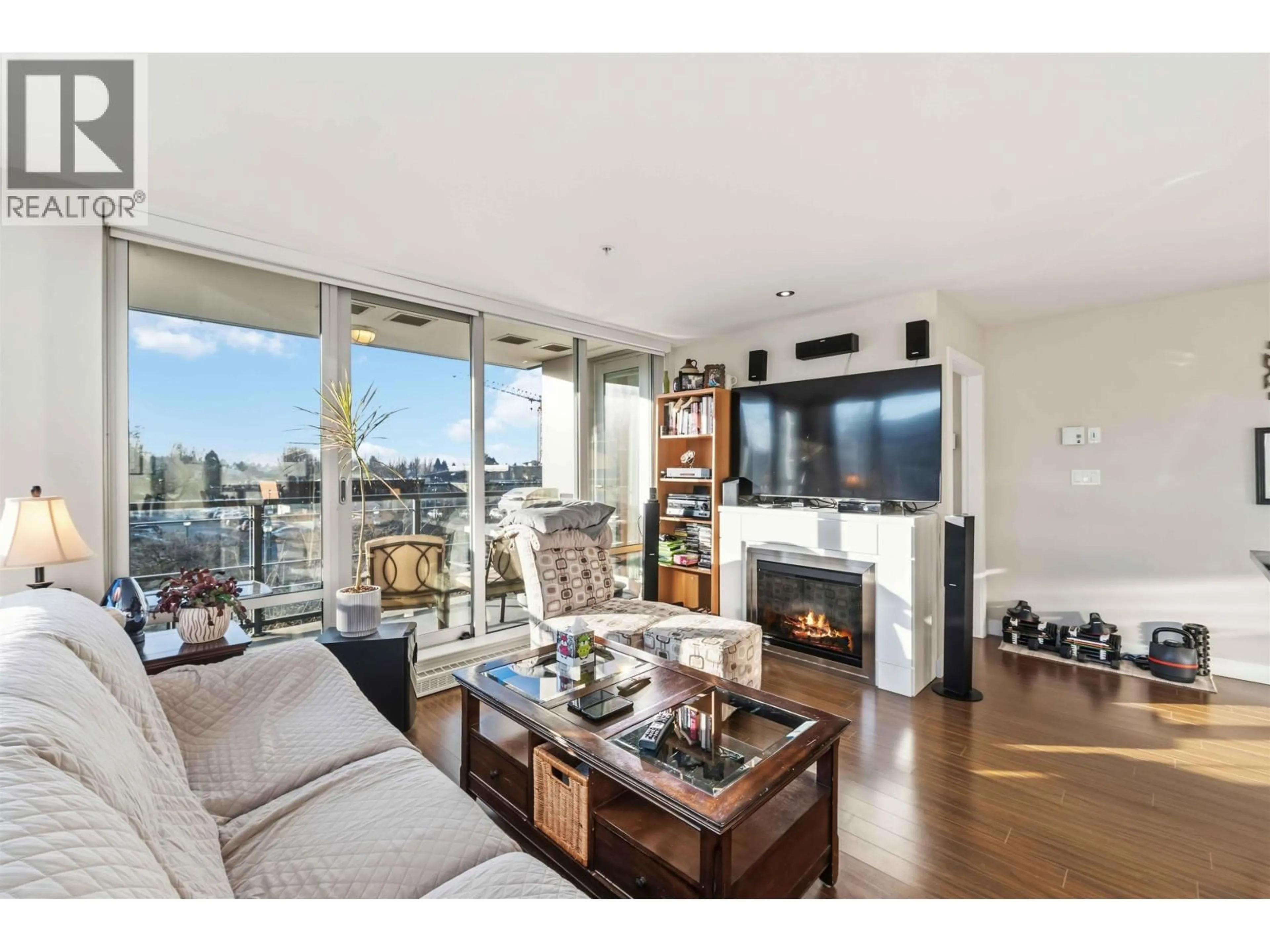 Living room with furniture, wood/laminate floor for 308 - 12069 HARRIS ROAD, Pitt Meadows British Columbia V3Y0C8