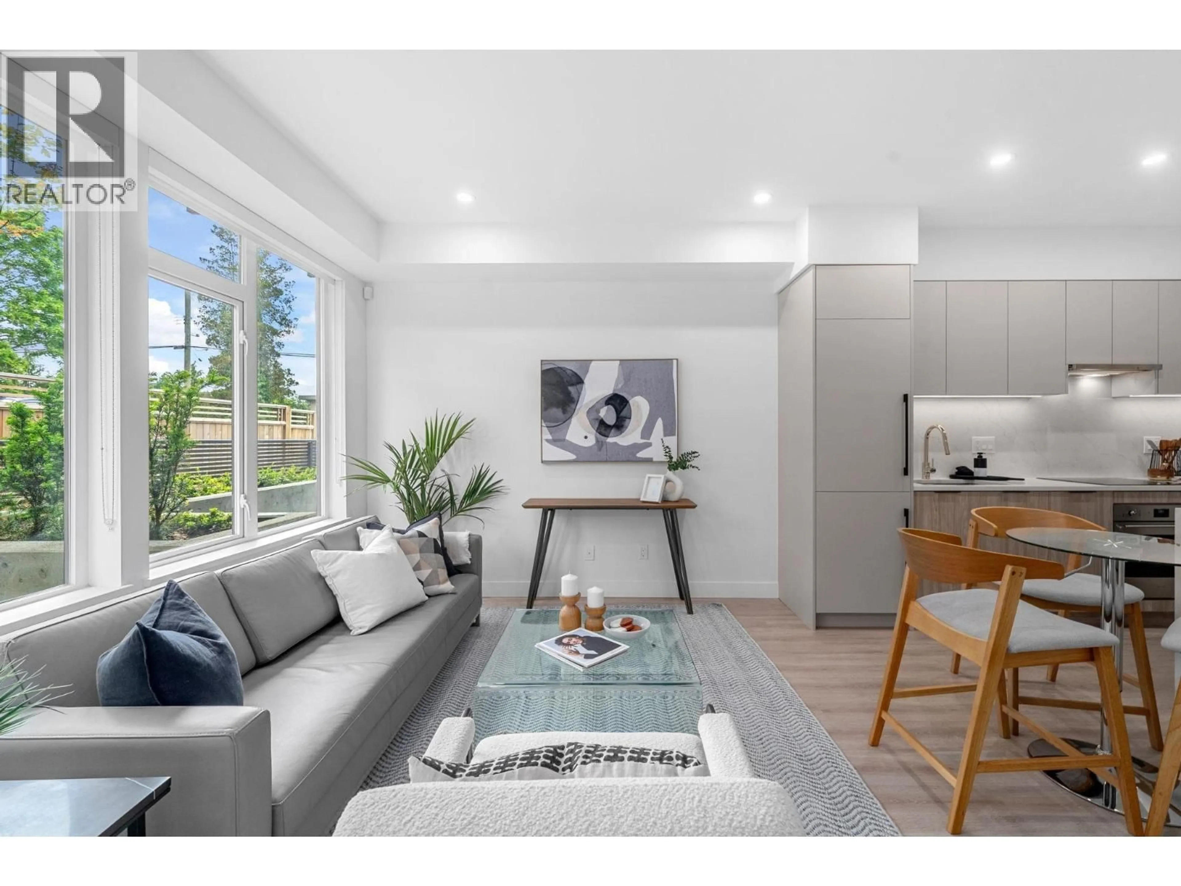 Living room with furniture, wood/laminate floor for 111 - 7161 17TH AVENUE, Burnaby British Columbia V3N1K8