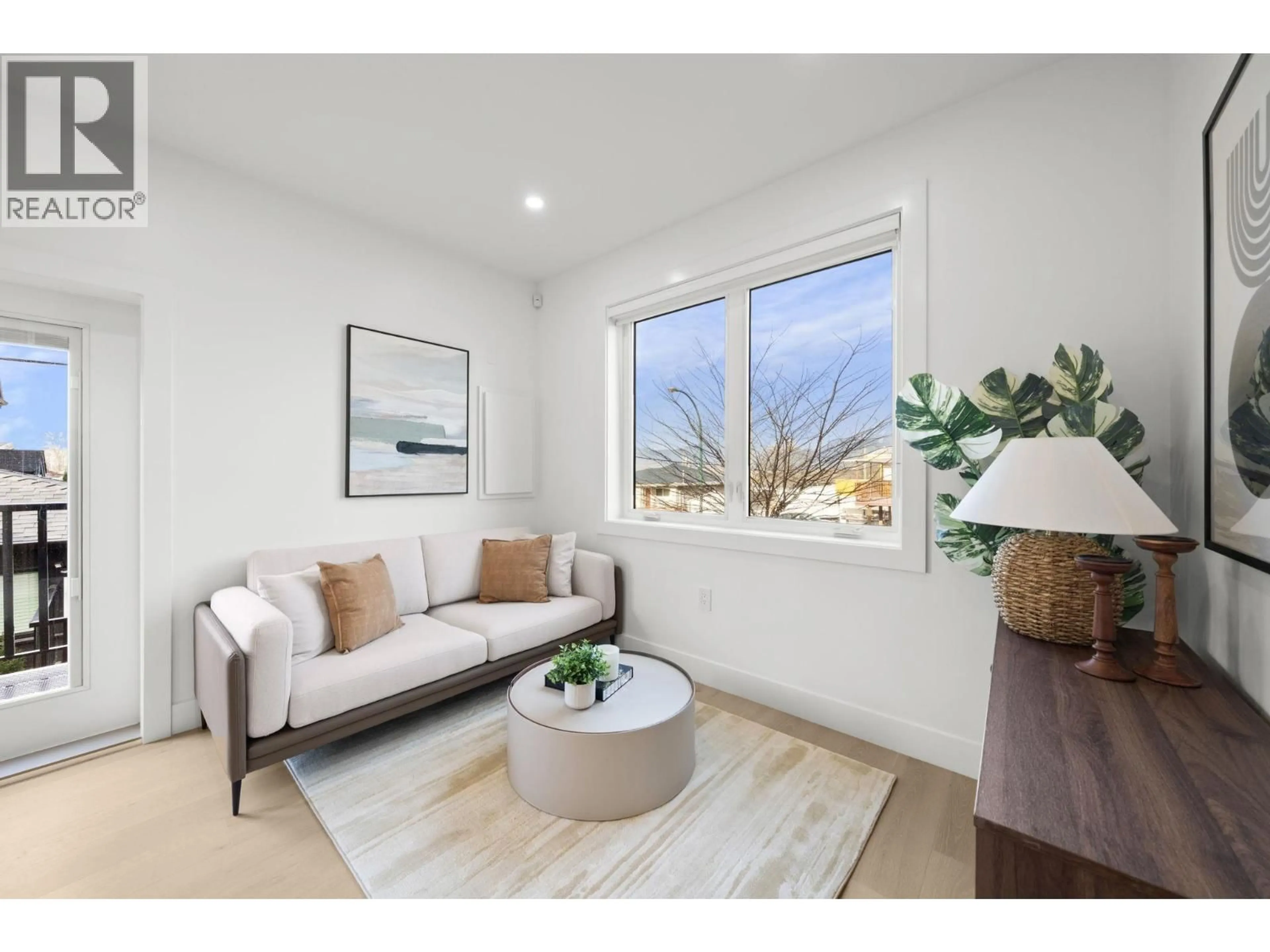 Living room with furniture, wood/laminate floor for 3192 23RD AVENUE, Vancouver British Columbia V5R2G5