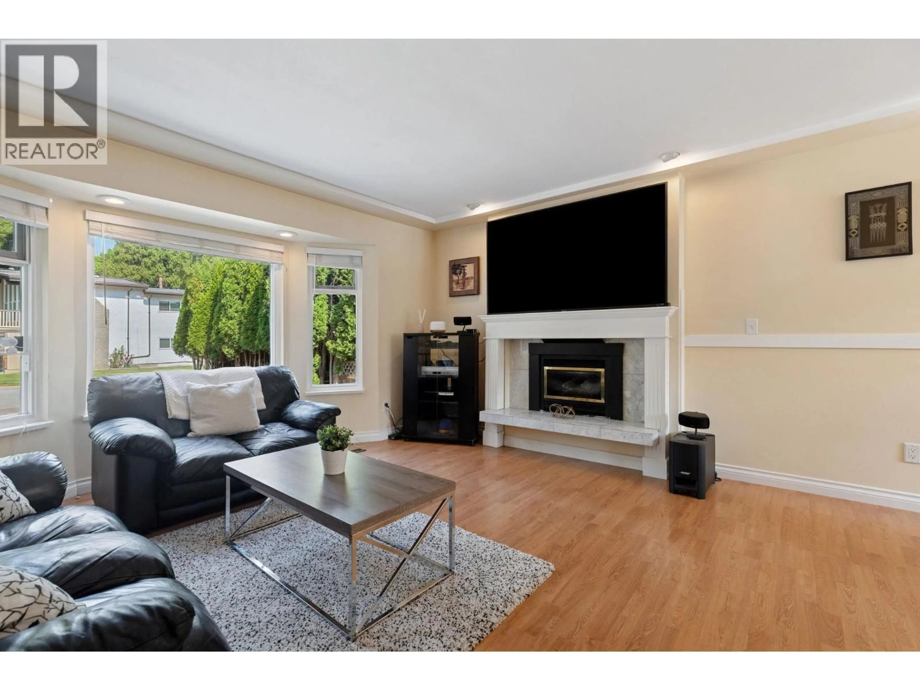Living room with furniture, wood/laminate floor for 1068 SPRUCE AVENUE, Port Coquitlam British Columbia V3B4X6