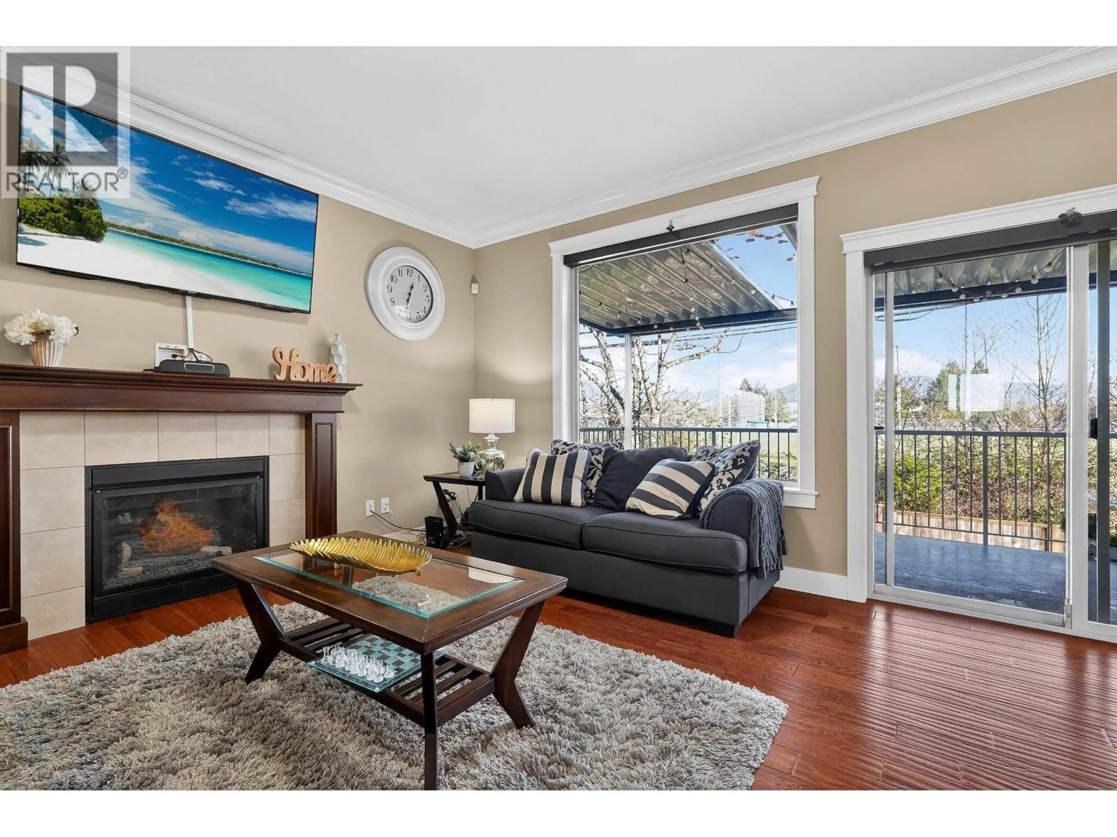 Living room with furniture, wood/laminate floor for 23015 OLUND CRESCENT, Maple Ridge British Columbia V2X9L3