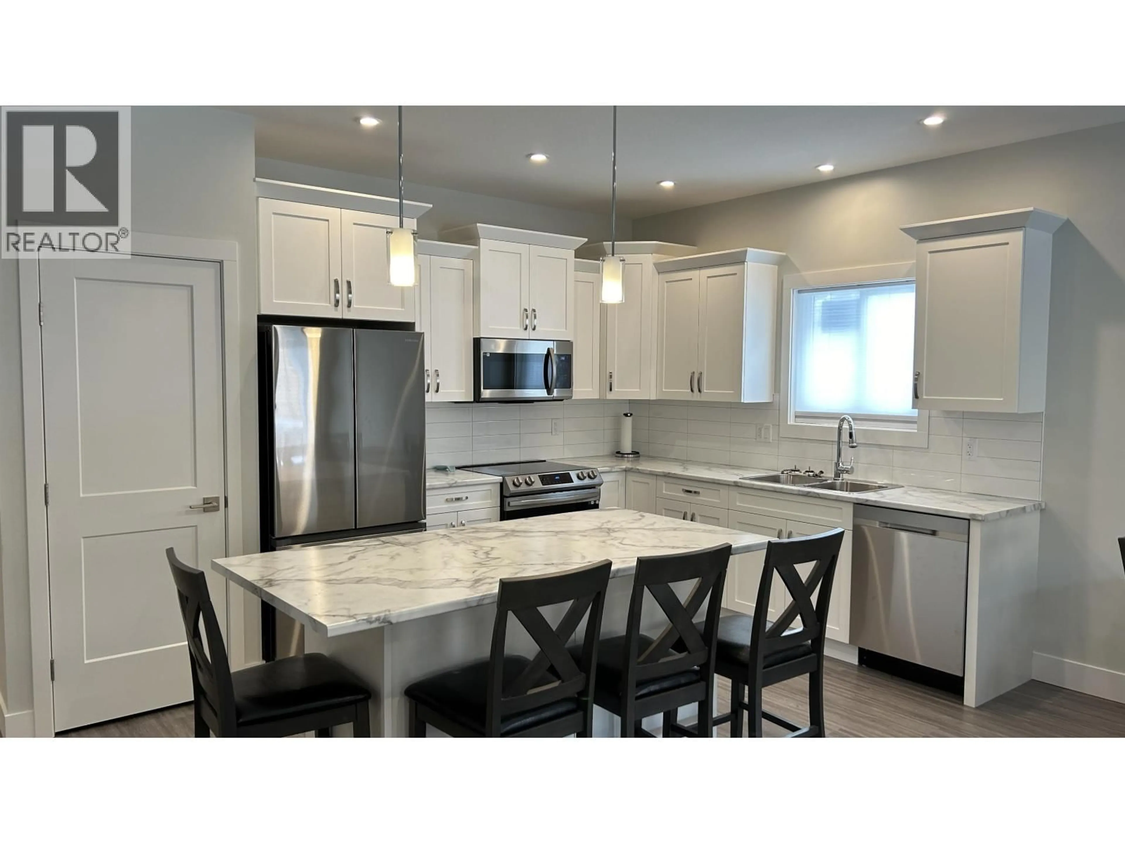 Open concept kitchen, ceramic/tile floor for 14 - 105 FOREST RIDGE ROAD, 100 Mile House British Columbia V0K2E0