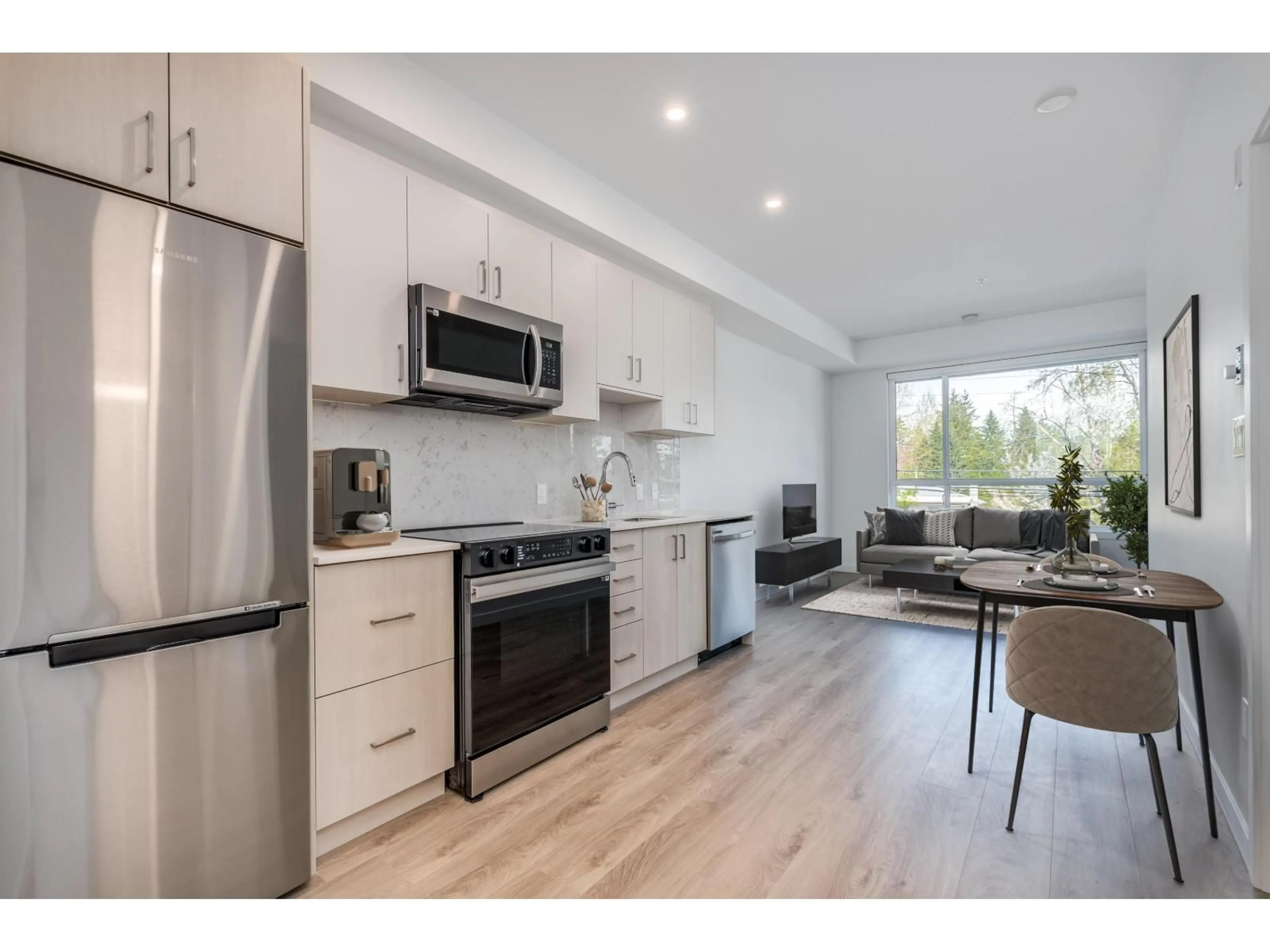 Open concept kitchen, wood/laminate floor for E216 - 13858 108 AVENUE, Surrey British Columbia V3T0T8