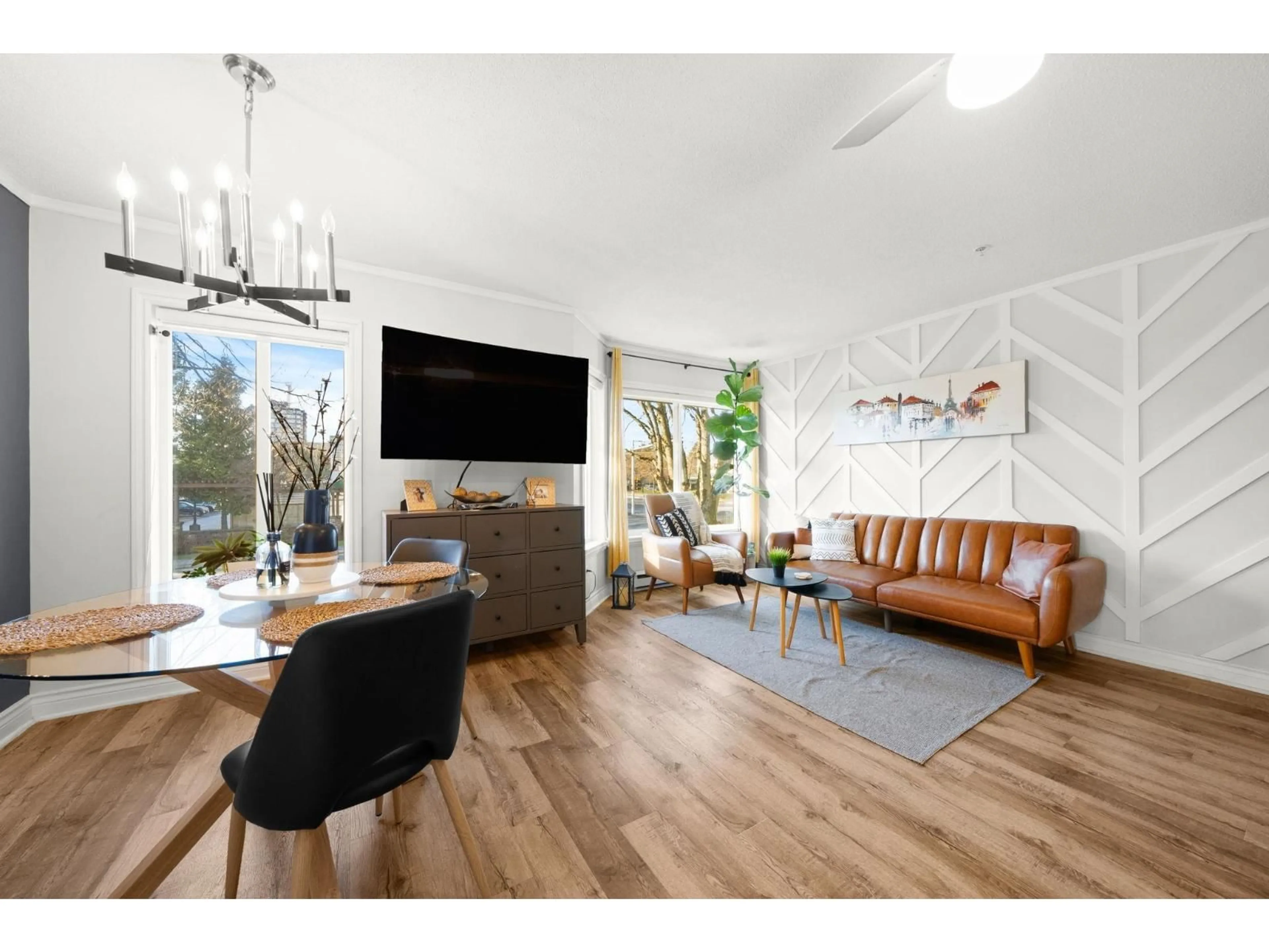 Living room with furniture, wood/laminate floor for 201 - 12110 80 AVENUE, Surrey British Columbia V3W0V2