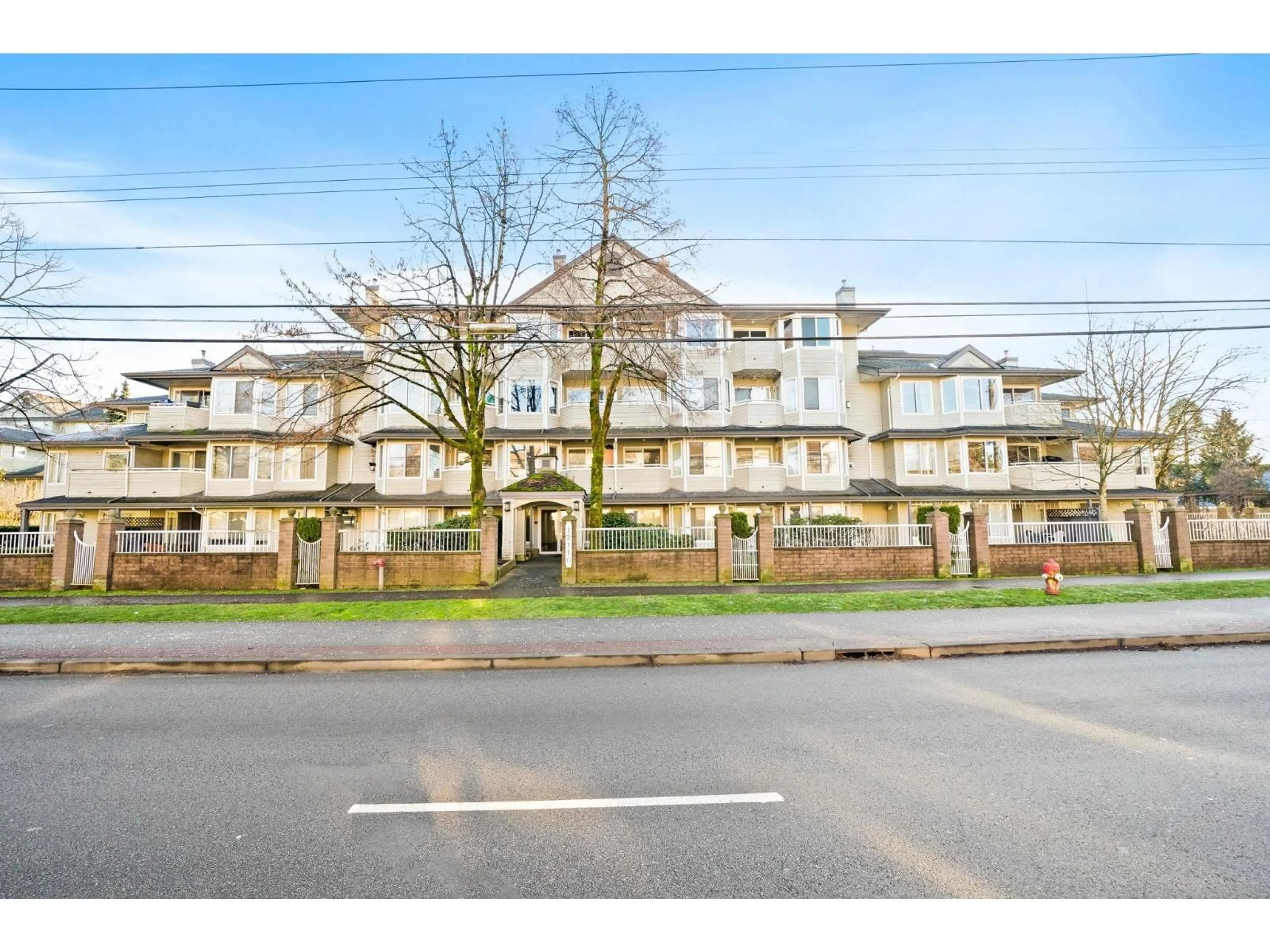 A pic from outside/outdoor area/front of a property/back of a property/a pic from drone, street for 201 - 12110 80 AVENUE, Surrey British Columbia V3W0V2