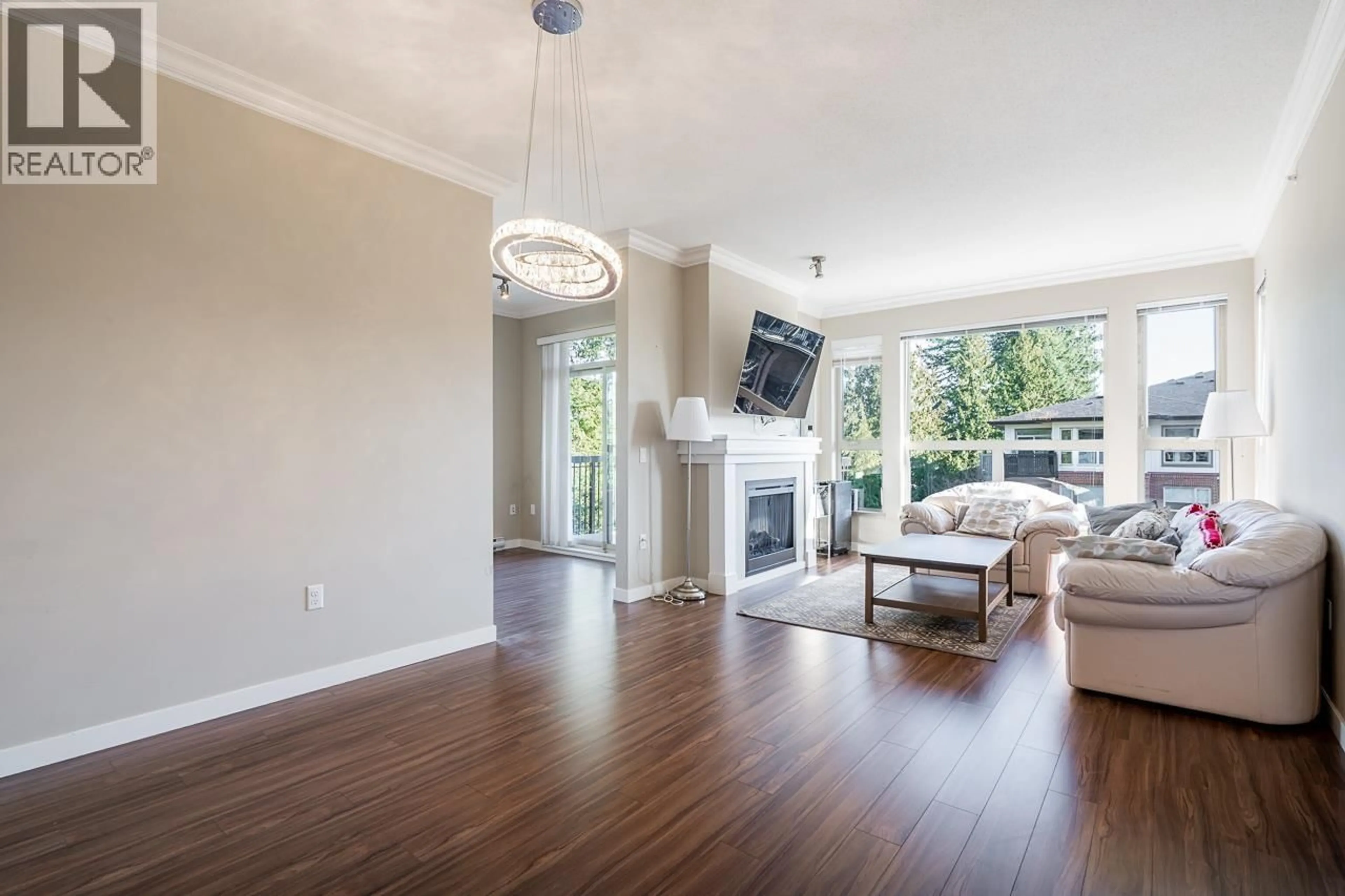 Living room with furniture, wood/laminate floor for 414 - 1150 KENSAL PLACE, Coquitlam British Columbia V3B0H4